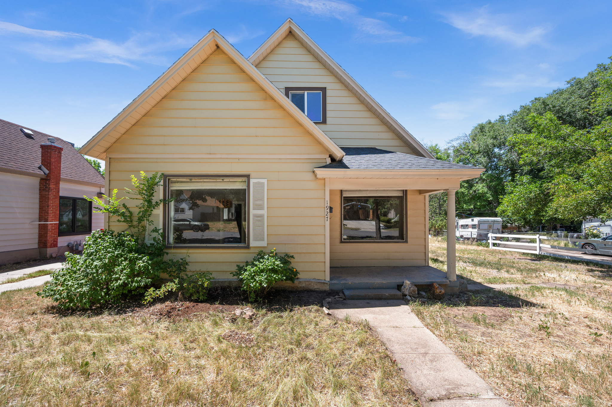 Charming East Bench bungalow on a spacious 0.28-acre lot! This updated 3-bedroom, 1-bath home offers the perfect blend of character and modern convenience. Enjoy abundant natural light, a cozy wood-burning fireplace, and an updated kitchen featuring granite countertops, white shaker cabinets, and stainless steel appliances.  The versatile upstairs bonus room is ideal for a bedroom, office, or hobby space. An owned solar panel system helps keep utility costs low, while the large yard offers endless possibilities for gardening, entertaining, or creating your own outdoor retreat. Mature trees, garden boxes, a storage shed, and ample parking add to the appeal.  Conveniently located near downtown Ogden, schools, shopping, dining, trails, and outdoor recreation. This East Bench gem combines charm, efficiency, and space in one exceptional property.  Square footage figures are provided as a courtesy estimate only and were obtained from county records.  Buyer is advised to obtain an independent measurement.