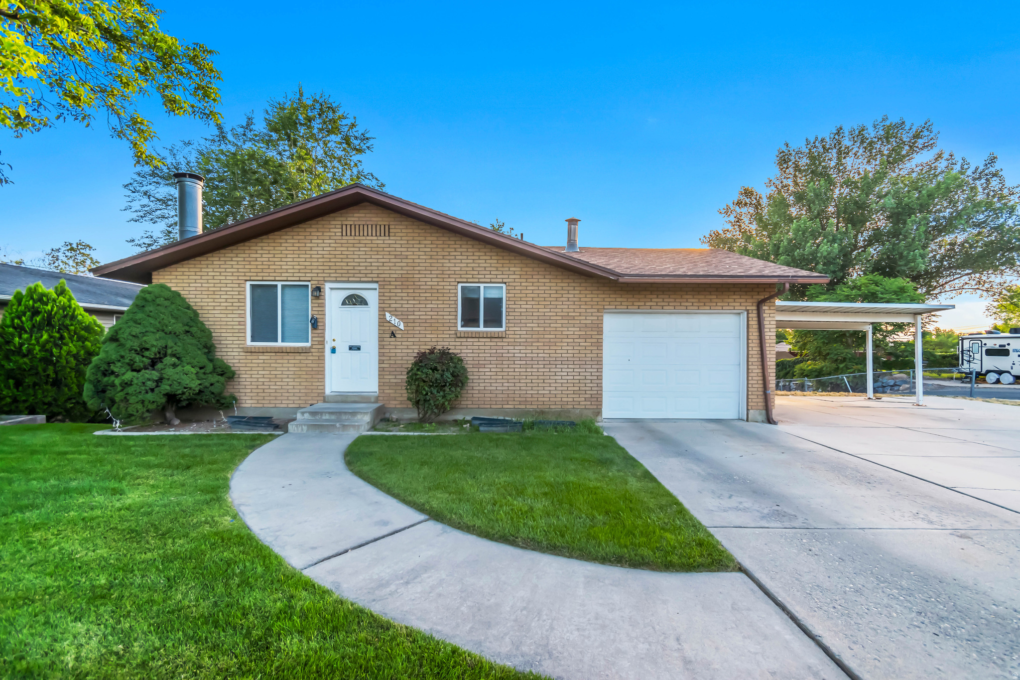 Fantastic rambler-style home located in the heart of Spanish Fork! Situated on a beautifully maintained .23-acre lot, this property features an immaculate lawn, mature trees, and established landscaping that create exceptional curb appeal and a peaceful outdoor setting. Inside, you'll find 5 bedrooms, 2.75 bathrooms, and 2,236 square feet of comfortable living space. The functional floor plan offers plenty of room for entertaining, or multi-generational living. Step outside onto the huge Trex deck overlooking the secluded backyard-perfect for relaxing, hosting gatherings, or enjoying Utah's beautiful evenings. One of the standout features of this property is its "Home Hack" potential. The home includes a separate ADU-style apartment with its own private entrance, offering an excellent opportunity for supplemental rental income, guest accommodations, or extended family living. A long-term tenant is currently in place and would love the opportunity to continue renting the space, providing immediate income potential for the new owner. Additional highlights include a detached 1-car garage, ample parking, and a convenient location close to schools, parks, shopping, dining, and everything Spanish Fork has to offer. Whether you're looking for a spacious primary residence, an investment opportunity, or a home with built-in income potential, this property checks all the boxes. Don't miss your chance to own this versatile and well-maintained home in a highly desirable location! Schedule your private showing today.