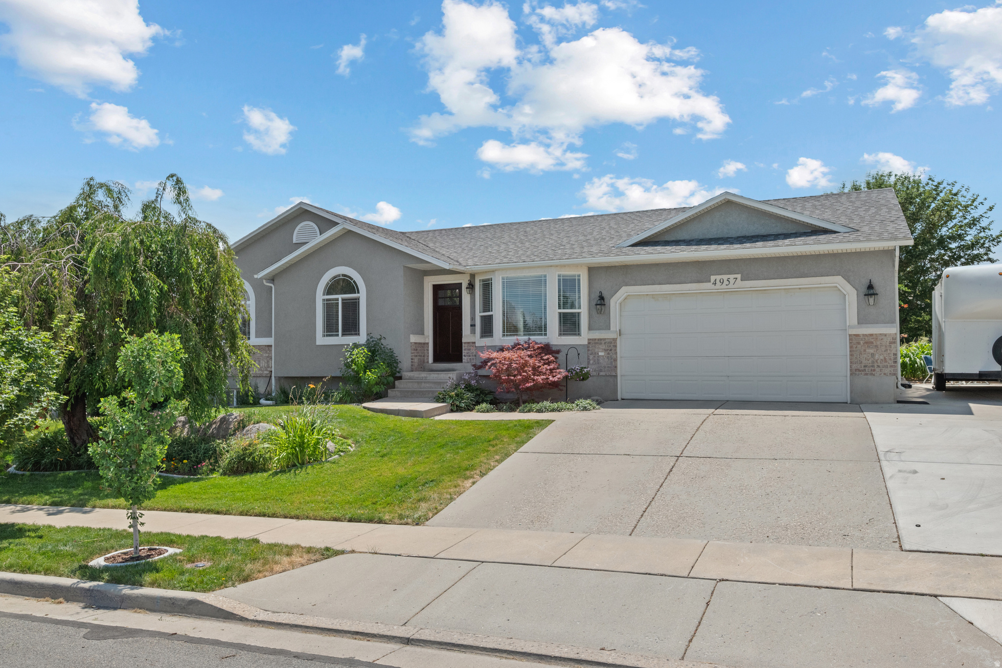 Nestled on a quiet, low-traffic street in Riverton, this exceptionally well-maintained 5-bedroom, 3-bath home offers the space, updates, and yard that are becoming increasingly difficult to find. The home has been well taken care of and is ready for the right family to love it again!   The open floor plan provides comfortable living and entertaining space, while the kitchen features granite countertops and a layout that flows seamlessly into the main living areas. Recent updates include a new HVAC system and furnace, new dishwasher, and recently replaced water softener.  Situated on the largest lot in the neighborhood (0.36 acres), the fully-fenced backyard is a hidden gem. Mature shade trees, established fruit trees, and a large vegetable garden create a private outdoor space to enjoy and entertain all year long.  Additional features include paved RV parking, automatic sprinklers, ample closet space, a large cold storage room, and no HOA. This meticulously cared-for home offers a rare combination of location, lot size, and livability.