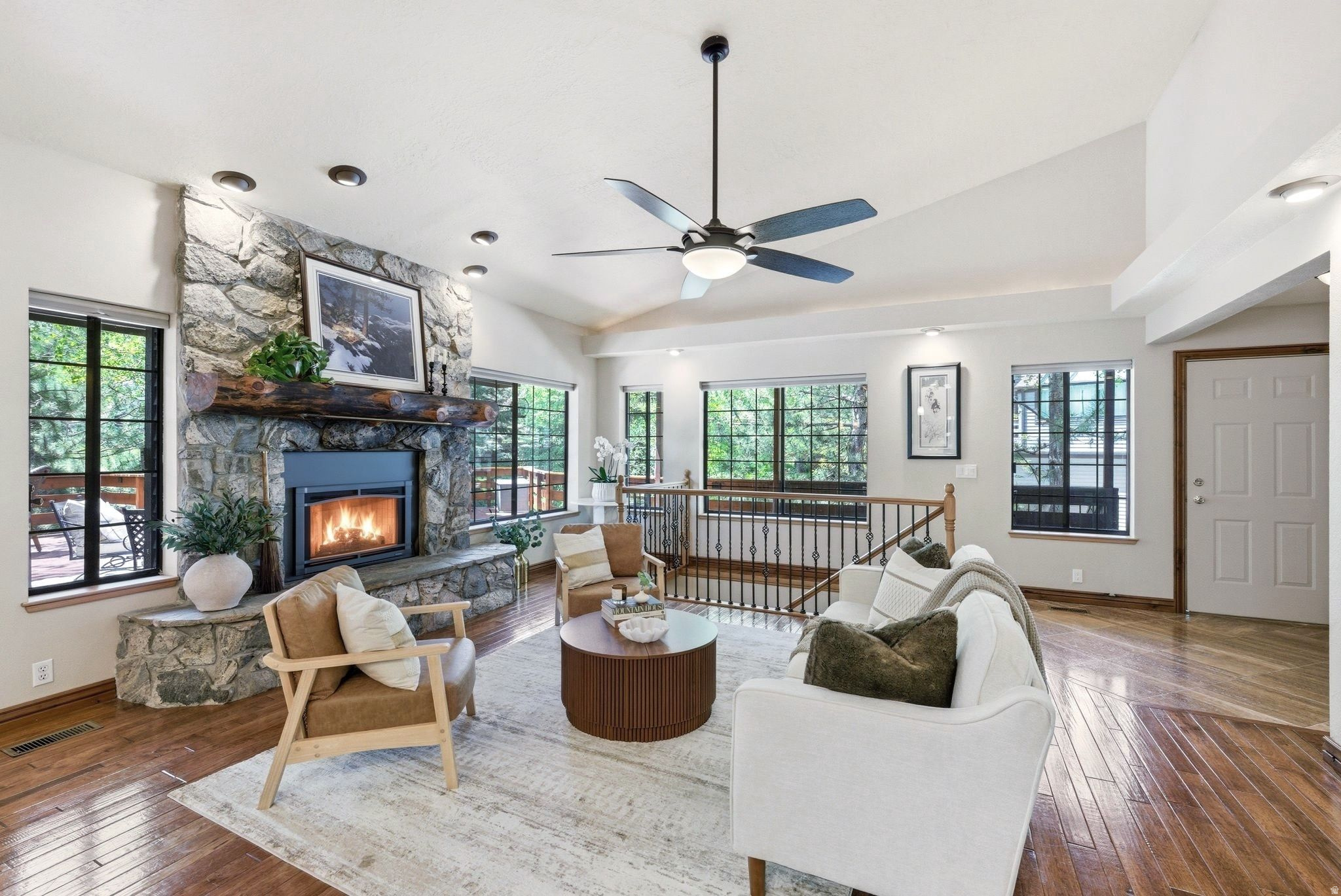 Welcome to 3057 Elk Run, one of only four duplex residences in the entire Elk Run community. Set along a year-round creek, this rare property offers more than 1,100 square feet of private deck space surrounded by mature trees, creating a peaceful setting for outdoor dining, relaxing, and enjoying the sounds of nature.  Inside, the home features approximately 2,923 square feet of well-designed living space. The main level includes an open great room with vaulted ceilings, large windows, and a cozy fireplace, plus a window-wrapped dining area with mountain views. The kitchen blends seamlessly into the main living areas with granite countertops and an easy, functional layout. The main-level primary suite includes its own fireplace for a warm, inviting retreat. The lower level offers a spacious family room and two en-suite bedrooms, ideal for guests or added privacy.  Located in Elk Run within Pinebrook, this home pairs quiet mountain living with quick access to trails, parks, shopping, dining, and the free Park City bus route. Just 10 minutes to Canyons Village and 15 minutes to Park City Mountain and Historic Main Street. HOA covers exterior maintenance, landscaping, snow removal, and insurance for low-maintenance living.
