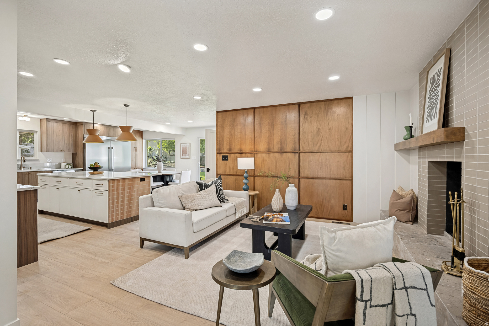 Discover the perfect blend of Midcentury Modern design and modern luxury in this completely remodeled home. Enjoy the peace of mind with a brand-new roof, electrical system, windows, garage door, plumbing, and AC unit. The interior features all-new cabinets and remarkable quartzite countertops, complemented by a professional-grade double fridge freezer combo and other brand new appliances, enhancing both style and functionality.  This home is on a rare flat lot on a .32-acre property, featuring two driveways and a brand-new sprinkler system. Experience unmatched convenience in a prime location. Situated in the heart of Bountiful, in an established neighborhood with a home that offers the fresh feel of a new home.  The property includes a basement apartment with its own entrance and dedicated parking, providing a great opportunity for additional income without the need to share parking. Whether you're seeking a beautifully updated home or a smart investment, this residence delivers on both fronts. Don't miss the chance to own a piece of Midcentury Modern elegance with contemporary upgrades.
