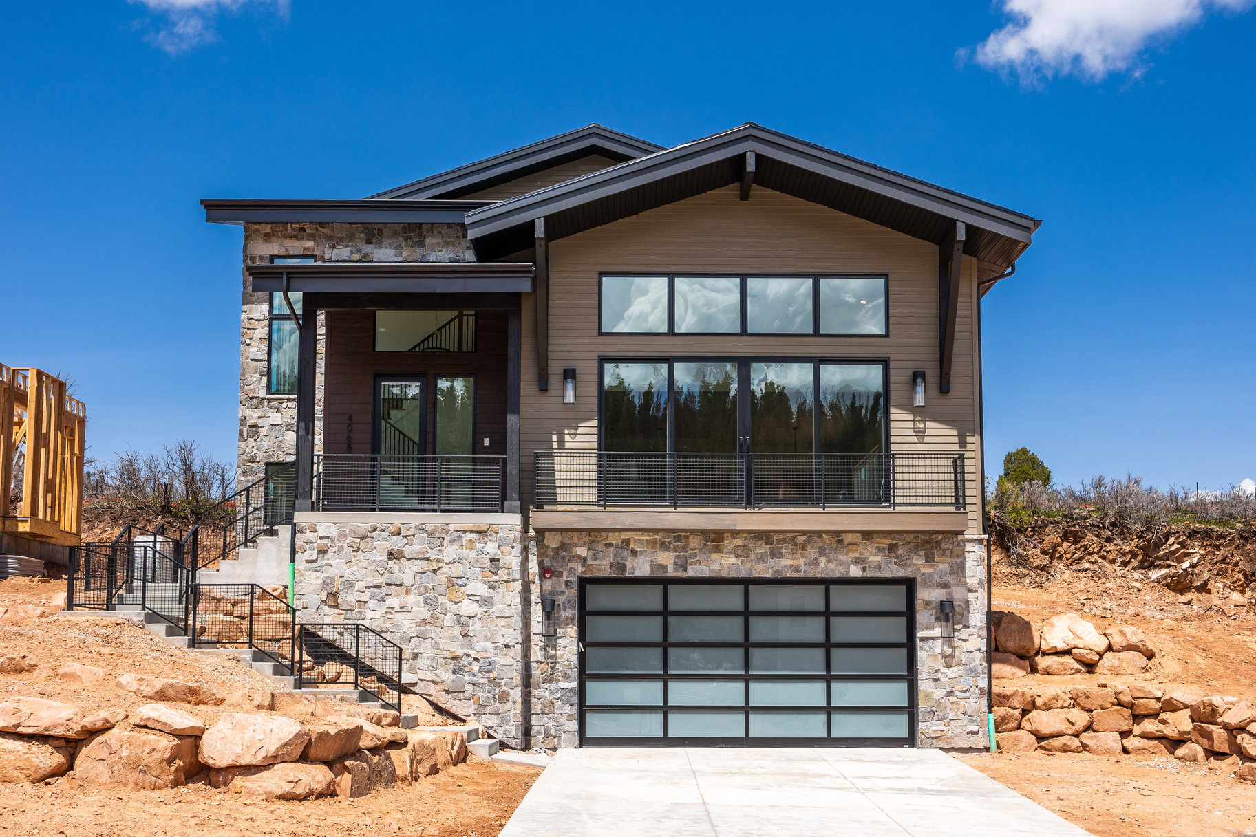Build your dream mountain retreat in Discovery Ridge, perfectly positioned along the beauty of Toll Creek Canyon. This semi-custom 4-bed, 4.5-bath home design features a chef's kitchen with professional-grade appliances and an oversized island ideal for gathering and entertaining. Two fireplaces-including a private one in the owner's suite-bring warmth and elevated comfort throughout. Interior selections can be personalized with premium finishes curated by Bowen Design of Park City, known for refined mountain-modern style. Enjoy seamless indooroutdoor living with two spacious patios on the main and upper levels, capturing panoramic 360 mountain views. Surrounded by protected open space with direct trail access and just minutes from both Park City and Salt Lake City, this offering blends luxury, privacy, and everyday convenience.