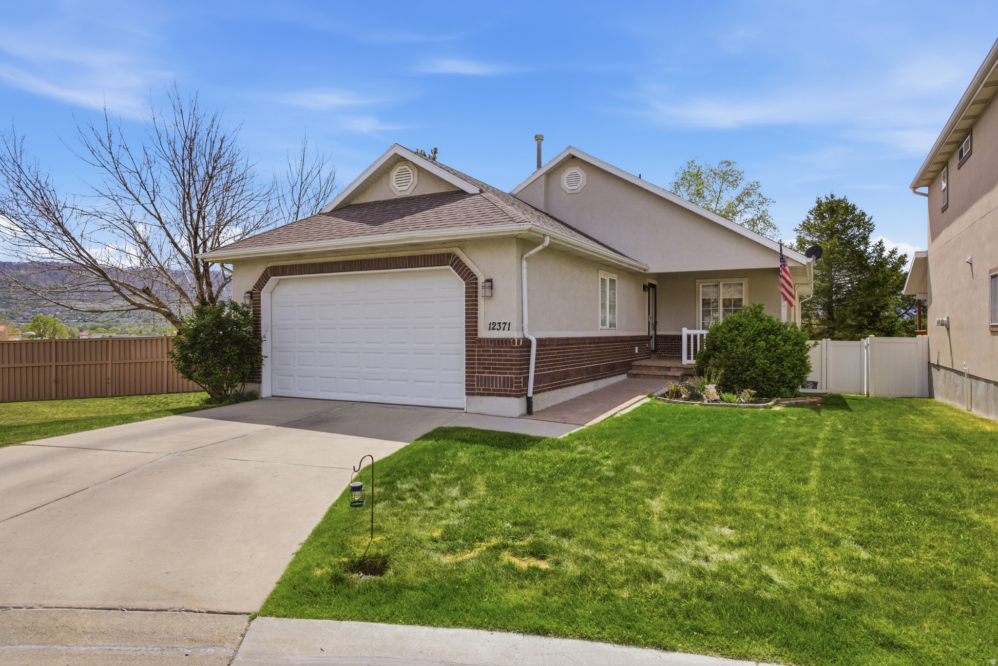 ***Improved price*** Experience the ease in this Draper cul-de-sac gem. The interior features beautifully updated kitchen cabinets and contemporary lighting. With laundry hookups on both levels and a dedicated basement entrance, the layout is as functional as it is inviting. Whether you're looking for a dedicated basement entrance or a maintenance-free lifestyle, this is it. Forget the lawnmower; the HOA maintains the yard so you can simply relax and enjoy the neighborhood. This home is conveniently located in the heart of Draper City. Walk across the street to the Draper Park, or take the nearby Trax to wherever you need to go, watch the