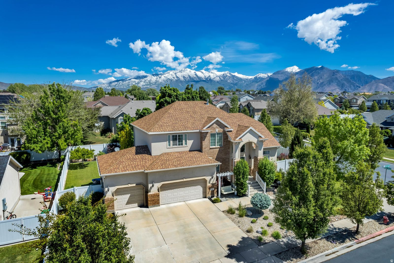 Stunning updated two-story home in the heart of Lehi offering space, comfort, & exceptional entertaining features throughout. This impressive residence features 7 bedrooms & 3.5 bathrooms w/ an open-concept floor plan, tall ceilings, & abundant natural light that creates a bright & inviting atmosphere. The beautifully updated kitchen w/ newer oven flows seamlessly into the main living areas, making it perfect for both everyday living & hosting guests. Downstairs, enjoy a dedicated movie room complete w/ theater equipment for the ultimate at-home entertainment experience. Step outside to a private backyard designed for gathering & relaxation, featuring a covered patio, mature trees, planter garden boxes, large yard, & swing set. Whether entertaining friends or enjoying a quiet evening outdoors, this space offers both privacy & functionality. Additional highlights include a basement entrance, ensuite bed/bath multi-zone A/C system for customized comfort, spacious 3-car garage, & two electric vehicle chargers already installed. Close to Costco, shopping, restaurants, & freeway this exceptional Lehi corner lot home combines modern upgrades, generous living space, & thoughtful amenities in one outstanding property.  Buyer to verify all info.