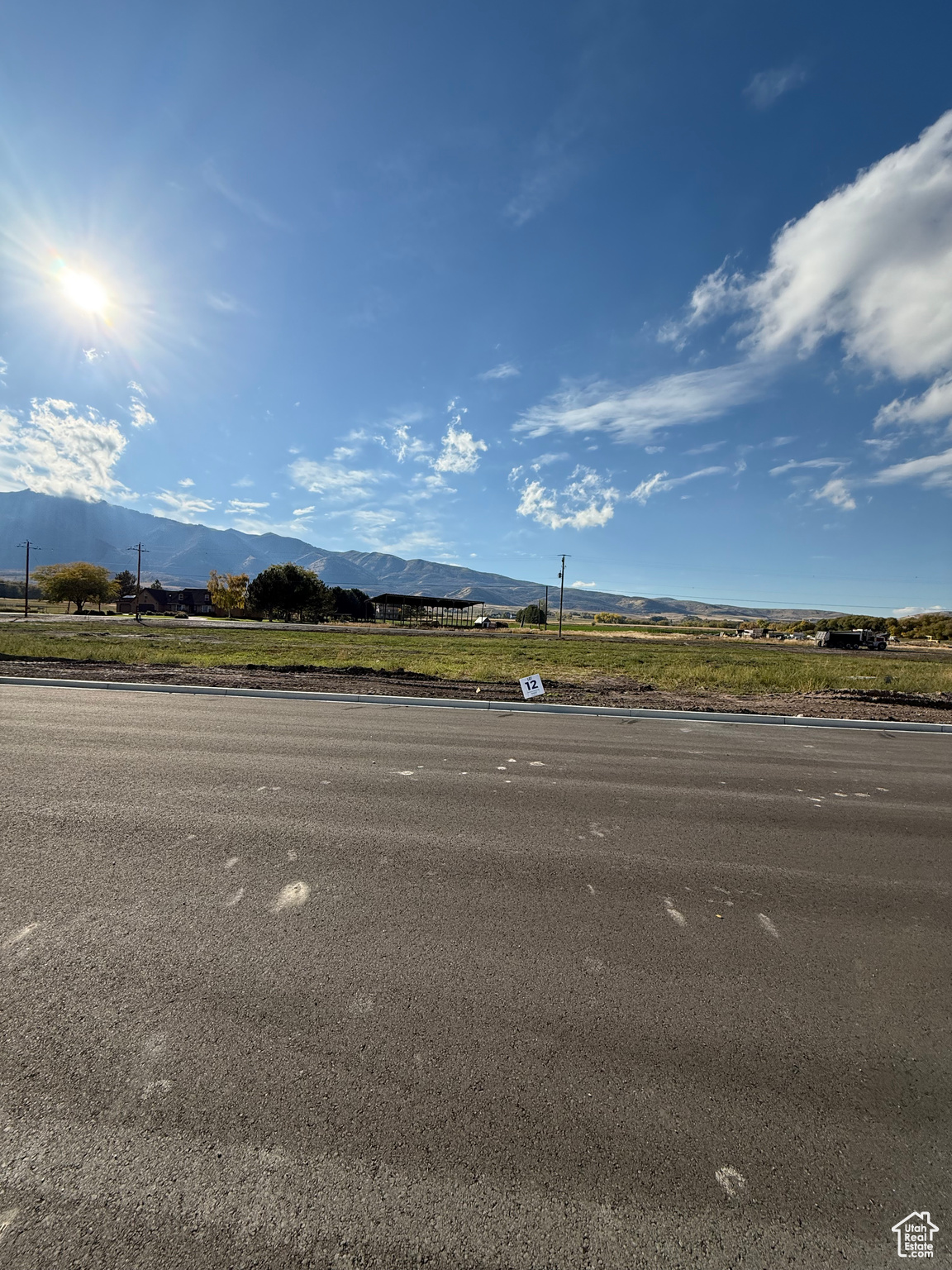 Bring your own Builder! Multiple lots available - Build your dream home in the peaceful and scenic community of Mendon. Blueberry Springs offers spacious 5/8+acre lots with breathtaking views of the mountains and valley. Enjoy paved public roads and full utility access, including Mendon City water, data, power, and secondary water stubbed to each lot. Irrigation water is managed and maintained by the Blueberry Springs HOA. Buyers are responsible for choosing and installing a septic system, subject to approval by Cache County. Each lot includes curb, gutter, and sidewalk frontage. This subdivision allows animal rights in accordance with Mendon City ordinances (https://mendoncityutah.gov). Bring your own builder and design your ideal home while adhering to city setbacks and protective covenants that maintain the neighborhood's appeal.