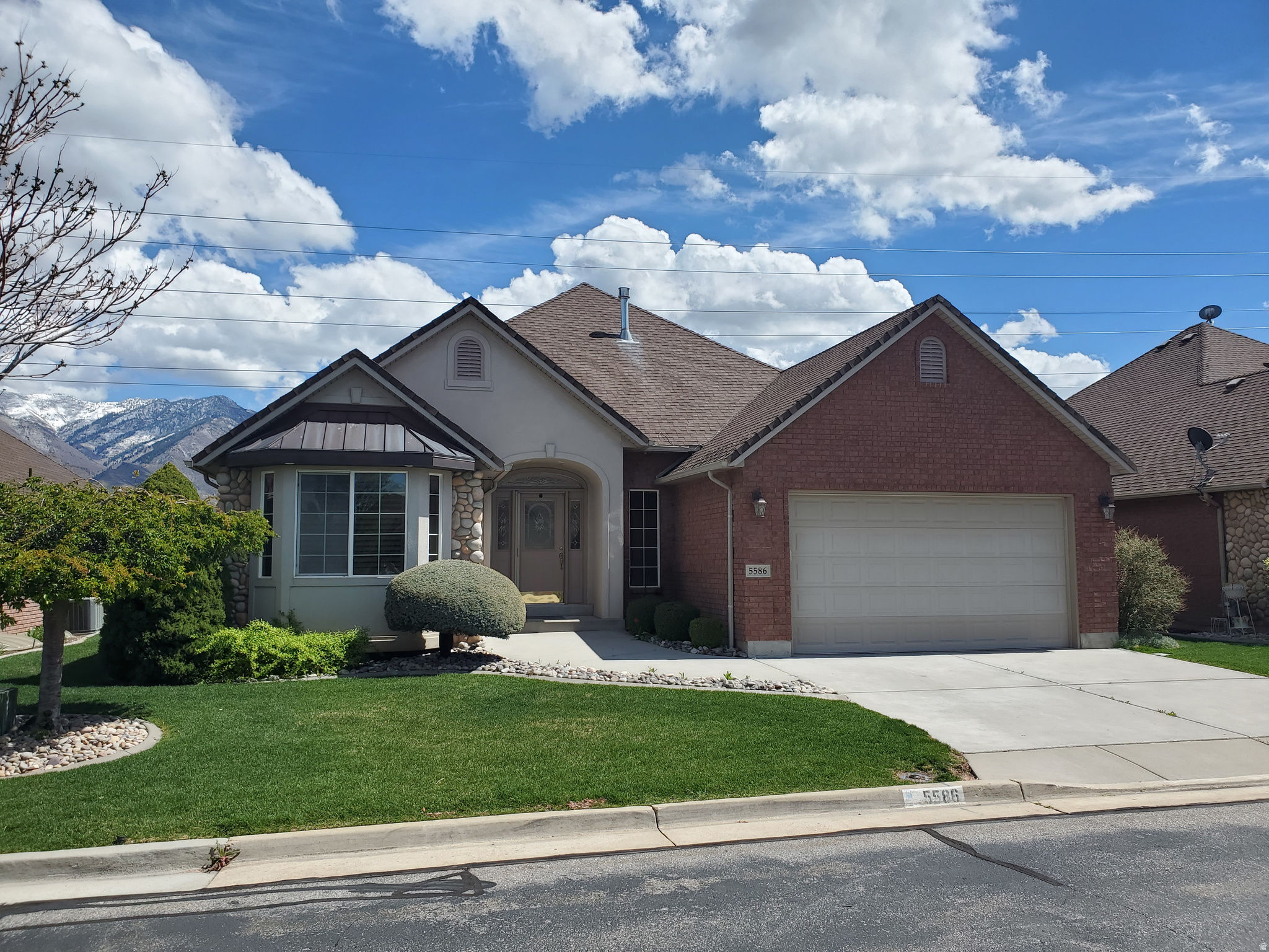 Come see this beautiful home located within The Cottages at Pleasant Valley! This open and spacious floorplan offer a simplified "lifestyle" with 2 of the 3 bedrooms, including the primary, laundry and office all located on the main floor! You'll love the incredible kitchen with separate designated dining area, central island with barstool seating, lots of storage, cabinets, counter and pantry space! The large great room boasts vaulted ceilings and a cozy fireplace making this a perfect spot for gathering with family and friends! You'll be drawn to the large picturesque windows as well as the peaceful covered patio, both of which offer amazing mountain views! The basement is fully finished and includes a third bedroom, bathroom, fireplace, and wet bar as well as an additional office or 4th bedroom option.  The HOA provides peace of mind while taking care of the maintenance of the home's exterior as well as all landscape and snow removal. Finally, there is a solar system included and will convey to the Buyer with the sale of the home. Centrally located to hospitals, schools, shopping, with simple freeway access, makes getting around town or trips to Salt Lake, Ogden Valley or Park City a snap! Call today to schedule your private showing.