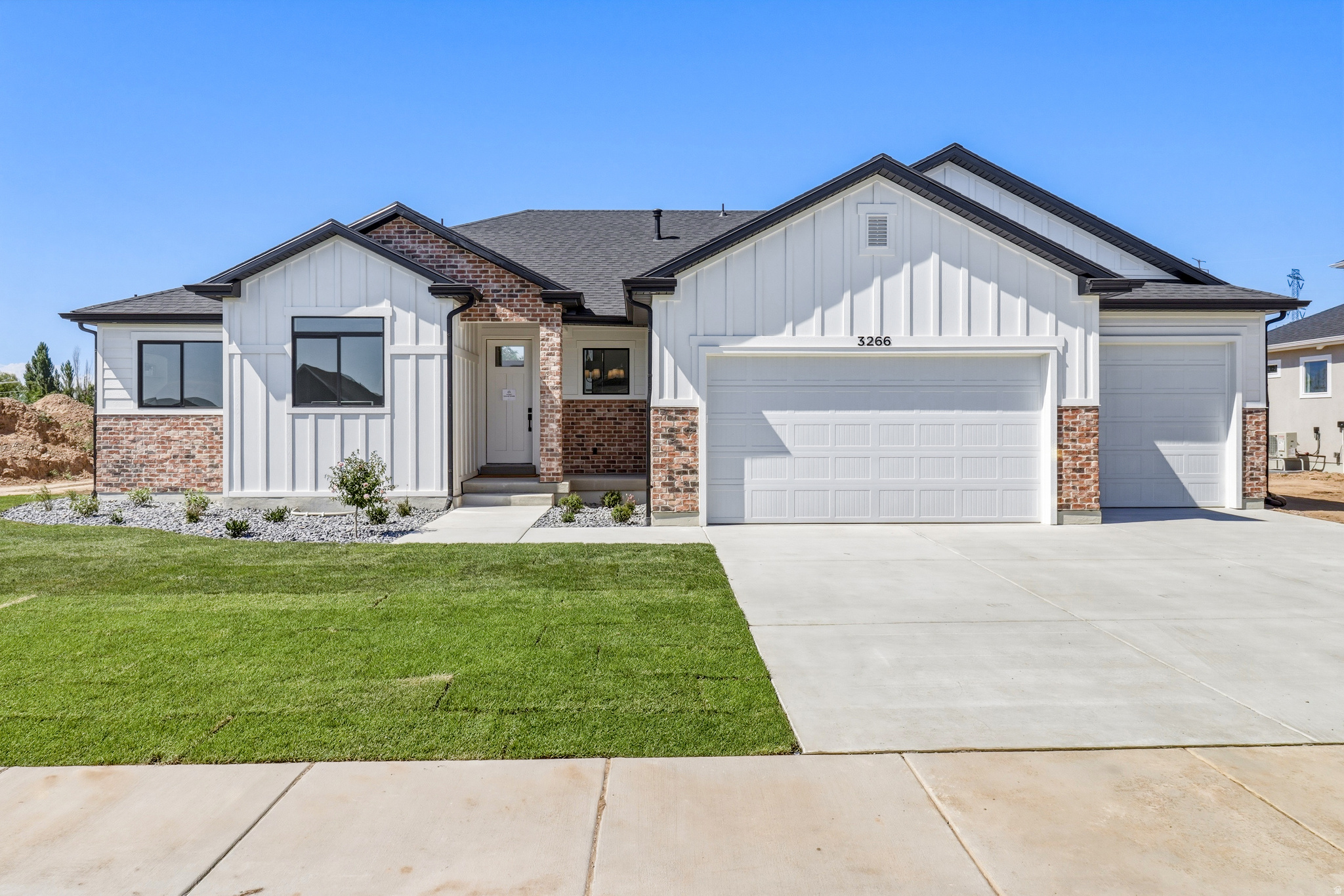 The Kingston floorplan combines spacious single-level living with designer finishes throughout. This fully finished rambler features soaring 13-foot ceilings in the great room, creating an open and inviting atmosphere perfect for entertaining. The gourmet kitchen showcases an oversized island, ceiling-height cabinetry, a decorative range hood, and striking black-framed windows for a modern touch. Enjoy outdoor living on the covered patio, along with the convenience of an extra-wide third-car garage and professionally landscaped front yard. Thoughtfully designed and loaded with upgrades, this home offers comfort, style, and functionality in every detail. The best part - $20,000 in incentives to use towards backyard landscaping, blinds, or an RV pad plus an additional $15,000 in preferred lender incentives!