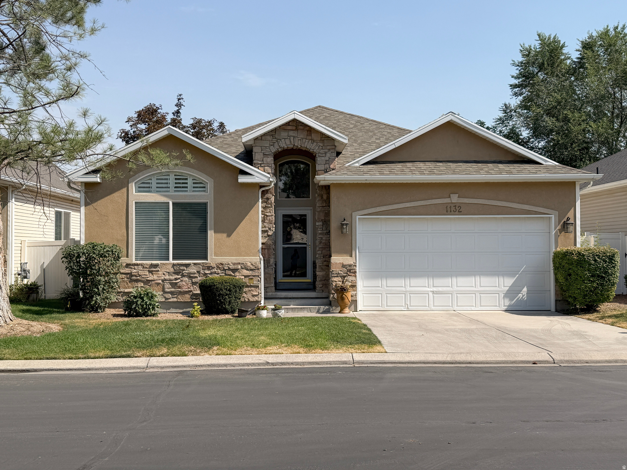 Single-level living in the gated Autumn Lane community. Vaulted ceilings run throughout the main level, giving the home an open, airy feel from the moment you step in. The spacious primary suite includes an en-suite bathroom and a large walk-in closet. The open floor plan connects living, dining, and kitchen, leading directly out to a fully fenced backyard with a patio. This is the perfect setting for BBQs and quiet dinners after enjoying the beautiful Utah outdoors. The exterior also boasts a new roof. The unfinished basement adds storage now and room to expand later - extra bedrooms, a home gym, additional living space, whenever you're ready. Under 15 minutes to SLC airport and downtown. Under an hour to six of Utah's top ski resorts. Autumn Lane is a gated community built for people who don't want to choose between city access and mountain access.