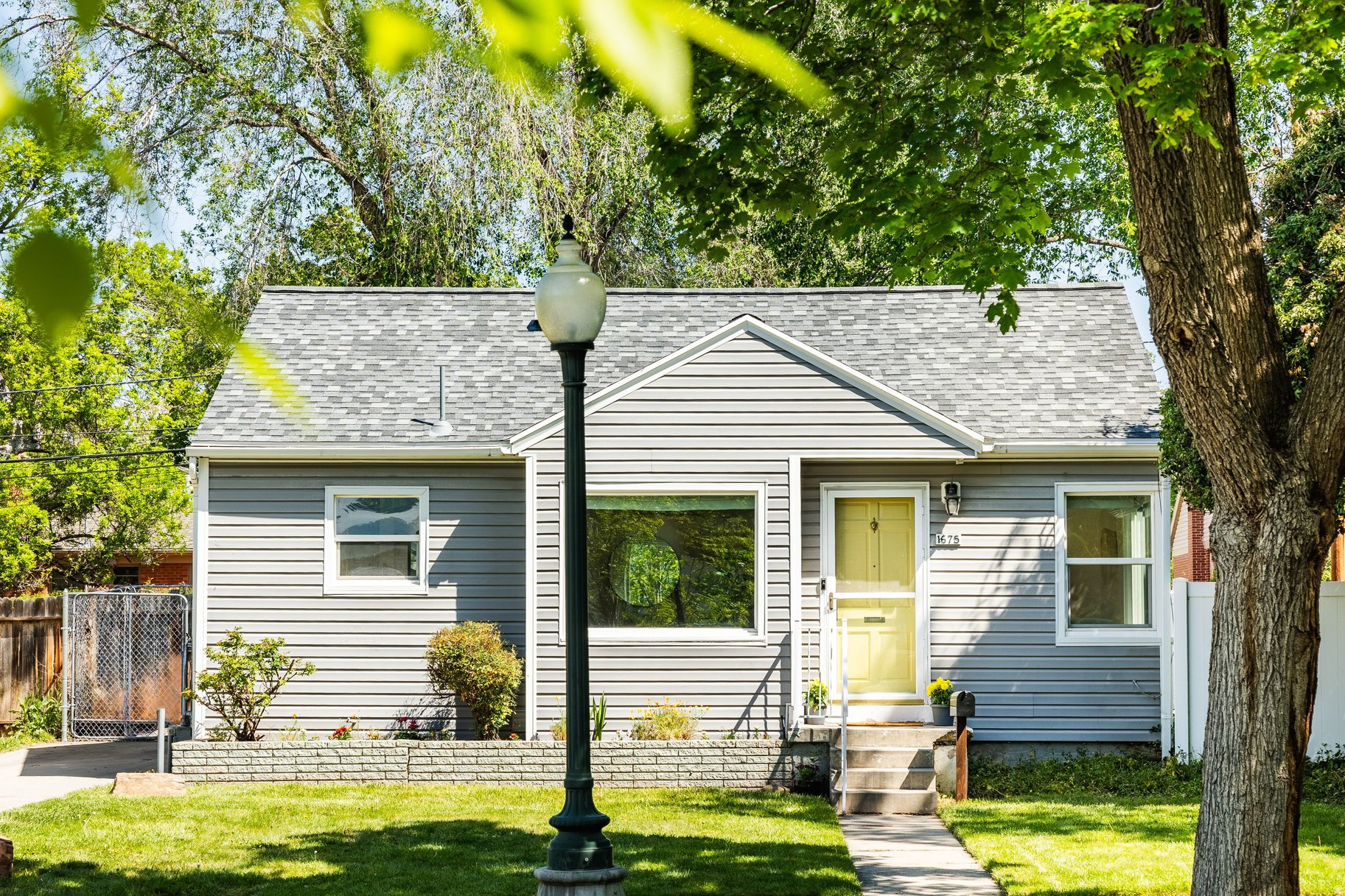 Back on the market, the buyer's financing failed. Some homes just fit. This Sugar House bungalow built in the 1940s and sitting quietly at the end of a dead end street is one of them. The kind of place where the hardwood floors and original character details tell you everything you need to know the moment you step inside. The updated kitchen is bright and functional without losing the charm the rest of the house has held onto. The mudroom does its job well, a proper landing spot that keeps the rest of the home feeling clean and collected. Three bedrooms. Two baths. A finished basement that gives you room to grow into perhaps a media room, home office, or guest suite. Whatever you need it to be. Out back is where this one really earns it. A private yard that feels like your own little secret, tucked away at the end of the street with no through traffic. The detached garage keeps things tidy.  The big stuff is handled. Brand new roof with a transferrable warranty, so next owners inherit the peace of mind along with the charm. Sugar House is one of Salt Lake's most loved neighborhoods for good reason. Coffee shops, restaurants, Sugarhouse Park, and easy access to I-80, all within minutes. The neighborhood has energy. This street has quiet. You get both.