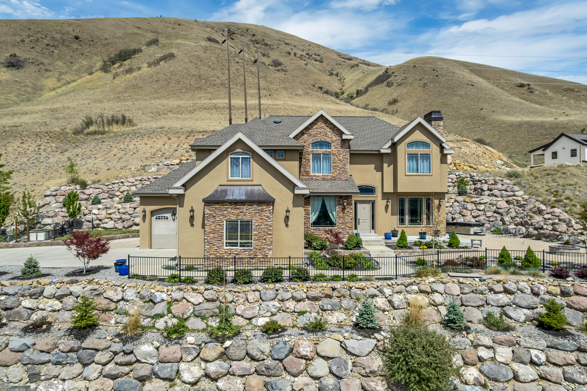 Beautifully updated 6-bedroom, 3.5-bathroom home featuring stunning views of the Utah Valley, mountains, and Utah Lake. This gorgeous property is located on the benches at the mouth of Hobble Creek canyon. The home has been recently updated with new interior paint and LVP flooring. The basement features a full kitchen with separate exercise and entertainment areas. This home has 5656 square feet of living space with a large main level family room and spacious bedrooms. The kitchen has plenty of space for entertaining and features a newly installed butler's pantry right off the kitchen that provides an enormous amount of additional storage and counter space. A second laundry room is located in the basement with a large storage area.    What makes this location special is that there are miles of paved trails for walking, jogging or bike riding within walking distance. Bartholomew Park is two minutes away where you can relax on a sandy beach, go swimming or fishing. If you enjoy hiking in the mountains, you will never run out of new trails to explore right out your back door. Hobble Creek Golf Course is just a few minutes up the canyon.  Additional features include:  New A/C's and furnaces installed in the past three years Jellyfish lighting  Large modern butler's pantry New roof installed two years ago Paver patio with gas fire pit  Spacious four car garage Radon mitigation system installed  Square footage figures are provided as a courtesy estimate only and were obtained from county records .  Buyer is advised to obtain an independent measurement.  Owner is a licensed agent and broker is related to Seller/agent.