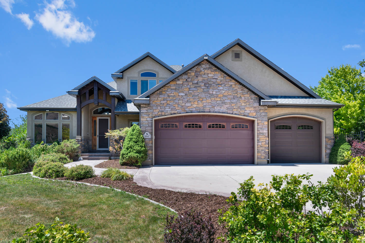 Tucked away in a peaceful, secluded setting, this beautiful two-story home welcomes you with breathtaking, unobstructed mountain views that create a stunning backdrop year-round. As you step inside, you'll find a thoughtfully designed floor plan that blends comfort, functionality, and space for everyday living. The heart of the home is the spacious kitchen, featuring elegant granite countertops, double wall ovens, and a gas cooktop-perfect for preparing meals while staying connected to family and guests. Just beyond the kitchen, the vaulted family room creates an inviting gathering space with soaring ceilings, abundant natural light, and a cozy fireplace that makes every season feel like home. Continue through the main level to discover the generously sized primary suite, offering a private retreat complete with a jetted tub, walk-in closet, and ample space to unwind after a long day. Step outside and enjoy the large covered patio, ideal for entertaining, relaxing, or simply taking in the tranquility of the secluded backyard filled with mature trees that provide beauty and privacy. Upstairs, you'll find three additional bedrooms, a spacious loft perfect for a home office, play area, or study space, and a full bathroom to comfortably accommodate family and guests. The unfinished daylight basement offers incredible potential with 9-foot ceilings and room for up to three additional bedrooms, a large family room, and plenty of storage-allowing you to customize the space to fit your needs. Car enthusiasts and hobbyists will appreciate the true four-car garage with extra height, providing exceptional space for vehicles, toys, tools, and equipment. This rare property combines privacy, mountain views, generous living spaces, and future expansion opportunities in one exceptional package. Buyer and/or Buyer's Agent to verify all information.