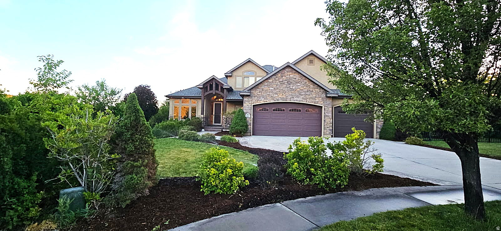 Tucked away in a peaceful, secluded setting, this beautiful two-story home welcomes you with breathtaking, unobstructed mountain views that create a stunning backdrop year-round. As you step inside, you'll find a thoughtfully designed floor plan that blends comfort, functionality, and space for everyday living. The heart of the home is the spacious kitchen, featuring elegant granite countertops, double wall ovens, and a gas cooktop-perfect for preparing meals while staying connected to family and guests. Just beyond the kitchen, the vaulted family room creates an inviting gathering space with soaring ceilings, abundant natural light, and a cozy fireplace that makes every season feel like home. Continue through the main level to discover the generously sized primary suite, offering a private retreat complete with a jetted tub, walk-in closet, and ample space to unwind after a long day. Step outside and enjoy the large covered patio, ideal for entertaining, relaxing, or simply taking in the tranquility of the secluded backyard filled with mature trees that provide beauty and privacy. Upstairs, you'll find three additional bedrooms, a spacious loft perfect for a home office, play area, or study space, and a full bathroom to comfortably accommodate family and guests. The unfinished daylight basement offers incredible potential with 9-foot ceilings and room for up to three additional bedrooms, a large family room, and plenty of storage-allowing you to customize the space to fit your needs. Car enthusiasts and hobbyists will appreciate the true four-car garage with extra height, providing exceptional space for vehicles, toys, tools, and equipment. This rare property combines privacy, mountain views, generous living spaces, and future expansion opportunities in one exceptional package. Buyer and/or Buyer's Agent to verify all information.
