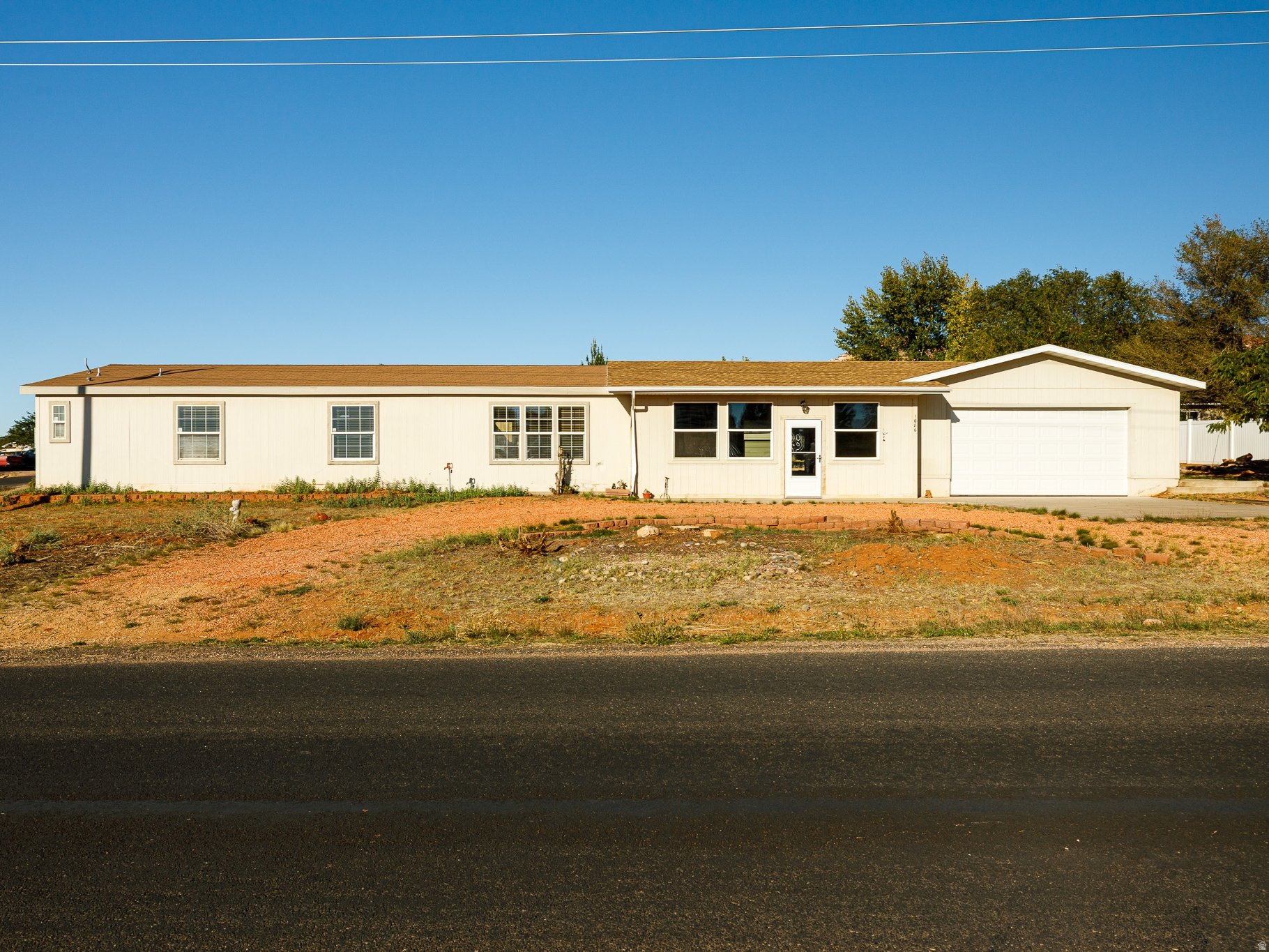 This inviting three-bedroom, two-bathroom home sits on a corner lot, offering room to relax and enjoy the Southern Utah lifestyle. Step inside through the large bonus room that connects the garage to the main living area; perfect for extra storage, hobbies, or a home gym. The open layout features a comfortable family room, dining area, and a generous kitchen equipped with a stainless steel dishwasher and range. Each bedroom provides plenty of space to unwind, with the primary suite located at the end of the home for added privacy. The primary bathroom includes dual sinks and a walk-in shower. Make this home your own and enjoy living just minutes from Zion National Park, Coral Pink Sand Dunes, and all the outdoor adventures Southern Utah has to offer! (Buyer to verify all)