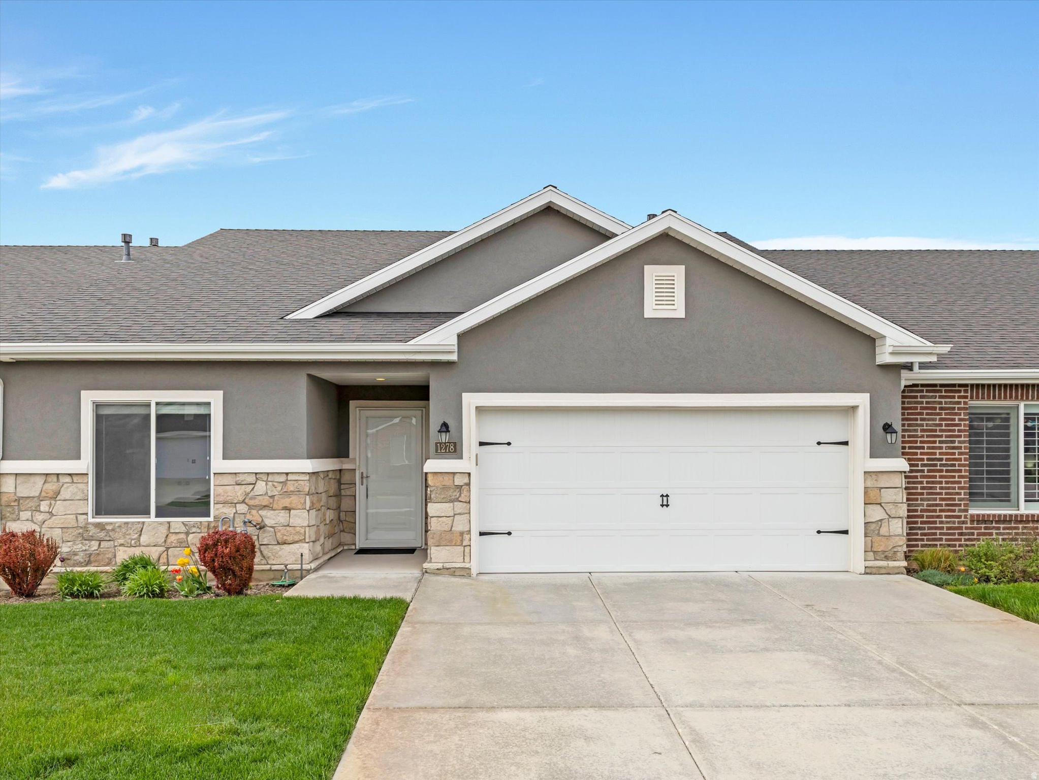 This beautifully updated former model home is move-in ready and waiting for you! Freshly painted throughout, this single-level gem is perfectly situated in a vibrant 55+ community where the HOA handles all exterior maintenance, so you can spend your time doing what you love. Enjoy soaring vaulted ceilings, stunning quartz countertops, a huge pantry with extra appliance storage, and a spacious open floor plan perfect for hosting family and friends. The oversized owner's suite features a soaking tub, separate shower, and generous closet space. High-efficiency HVAC, top-quality construction, and a two-car garage round out this exceptional home. Community pickleball courts and easy access to biking and running trails make this the perfect blend of comfort and active living.