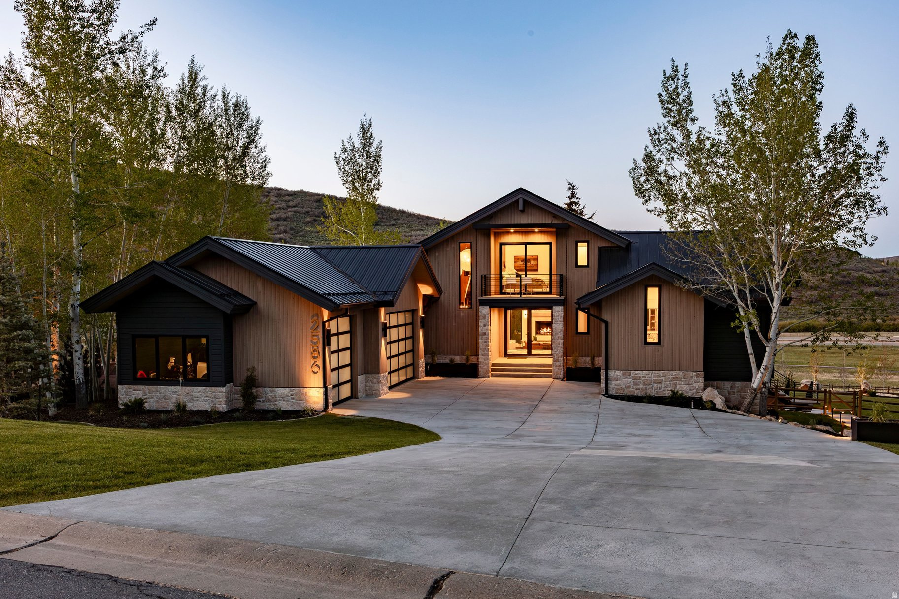 Completely reimagined and meticulously rebuilt, this exceptional Park City home has been transformed with walls thoughtfully relocated, square footage expanded, and nearly every feature redesigned to create a sophisticated modern mountain retreat with expansive views. The stunning chef's kitchen showcases premier commercial-grade appliances, luxury materials, and exceptional craftsmanship, creating a space equally suited for intimate gatherings and grand-scale entertaining.  The interior boasts heated tile floors throughout all tiled areas, wireless Wi-Fi speakers throughout the home, and more than $250,000 in custom lighting, thoughtfully curated to enhance the home's architectural beauty and ambiance. Outdoors, enjoy a newly constructed heated deck, private hot tub, and breathtaking new landscaping featuring mature trees, irrigation, and dramatic uplighting. Both the driveway and roof are heated and equipped with all-weather sensors, providing year-round comfort and convenience.  The result is a residence that lives like new construction, featuring all-new electrical, plumbing, roofing, and siding while preserving the character, views, and coveted location that make Park City one of the West's most sought-after destinations. Rarely does an opportunity arise to own a home where years of vision, design, craftsmanship, and investment have already been executed at such an extraordinary level.  Far beyond a typical remodel, the extensive improvements include larger new windows throughout, flooding the home with natural light and framing the surrounding mountain scenery, an added bedroom and bathroom, thoughtfully reconfigured living spaces, and elevated finishes selected with uncompromising attention to detail. This is a rare opportunity to enjoy the quality, efficiency, and sophistication of a newly built luxury residence while benefiting from an established setting and exceptional views.