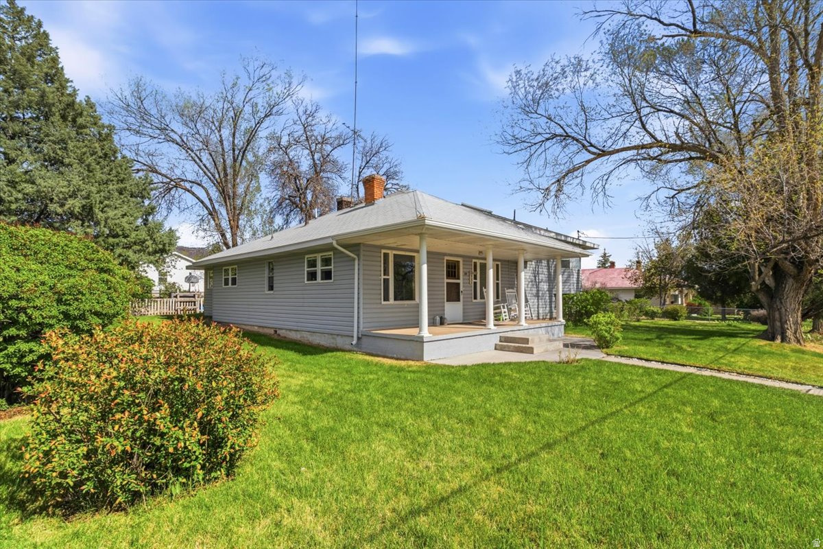 Adorable turn of the Century house on a corner lot in Fairview. This house has so much love and character about it. Lots of storage, fun floor plan with 3 levels. .43 acre beautiful yard with so many flowers, bushes, and shade trees. Nice deck and patio for relaxing and entertaining your guests. 2 shares of Cottonwood Gooseberry Irrigation water included. Large 2 car detached garage, with 2 storage rooms, and a 270 sq ft bonus room above for entertaining friends and family or could also be a large storage room. This house is great, you gotta come and see it to love all that it offers.