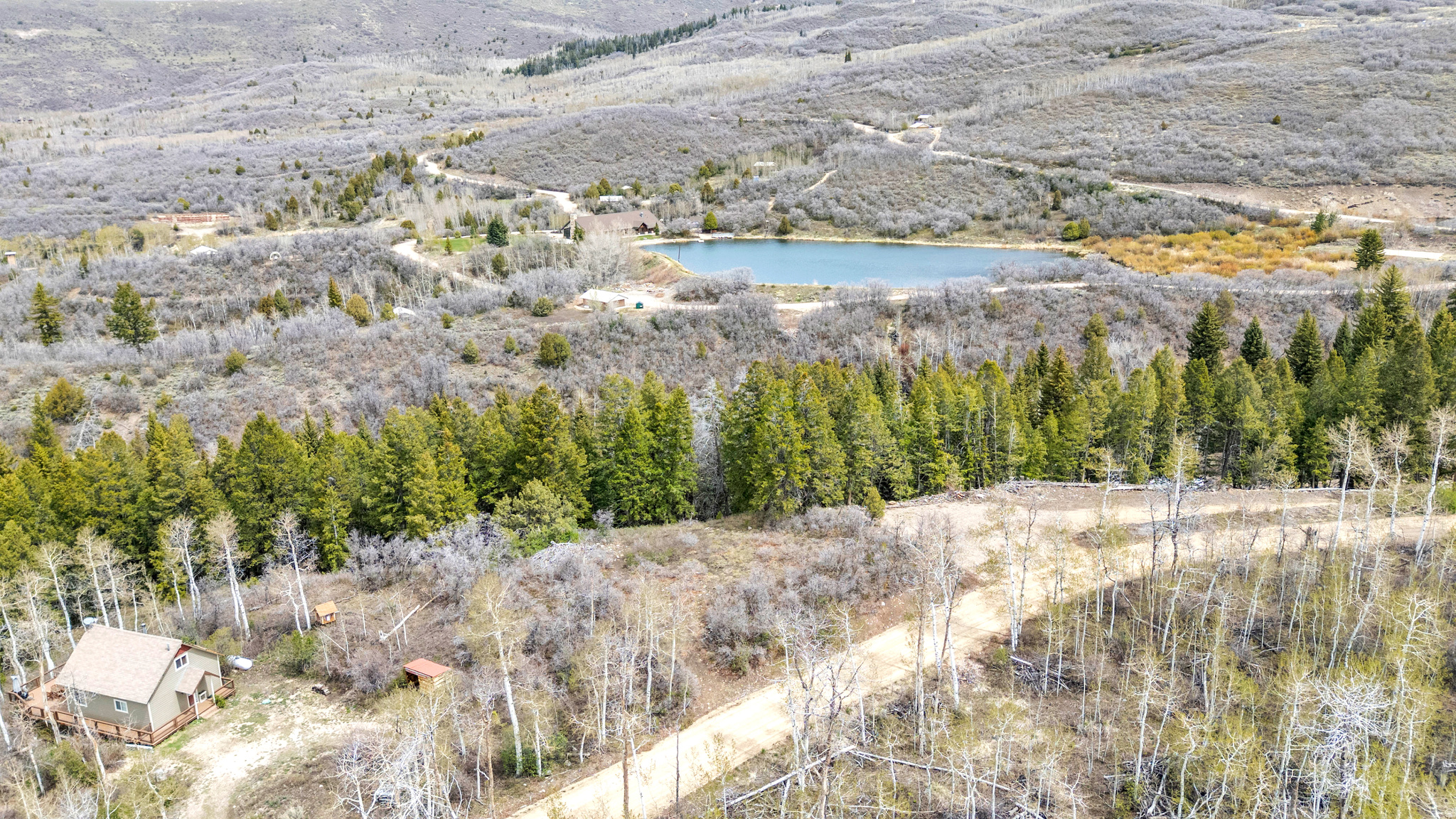 Don't miss this special opportunity to own a vacant lot in the desirable Timberlakes community. Ideally situated with year-round access, this property offers the perfect balance of mountain seclusion and convenience. Enjoy being surrounded by endless outdoor recreation-hiking, biking, snowmobiling, and more-while still just minutes from Heber City for shopping, dining, and an easy commute.  The soil and percolation test have already been completed, and the lot is approved for a 3-bedroom, 2-bathroom cabin or home, saving you time and giving you a head start on building. Whether you're looking to create your dream mountain retreat or expand your space by purchasing the neighboring cabin as well, this is a rare opportunity to secure privacy and potential in one of the area's most sought-after locations.  This is your chance to bring your vision to life in Timberlakes.