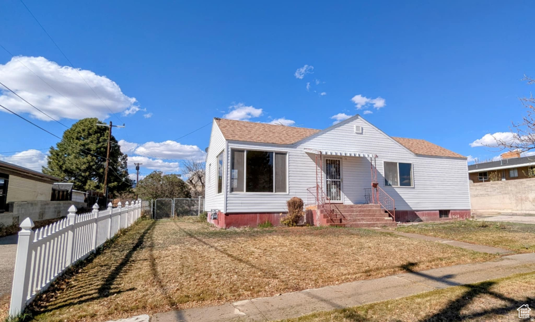 This charming 3 bed room, two bath home is a perfect opening for investors or buyers looking for a home to call their own. Great for a first-time home buyer or investor! PRIME location, directly across from USU Eastern College. Walking distance to main street, restaurants, parks, schools and the Museum. Entertain your guests in the large living room or host family gatherings in the spacious kitchen. The basement offers plenty of room for storage. Large detached Two car garage and fenced in yard. Updated windows and exterior siding. Now is the perfect time to make this affordable home your own. Don't miss out on the opportunity to become a homeowner without breaking the bank. Home  is sold AS IS