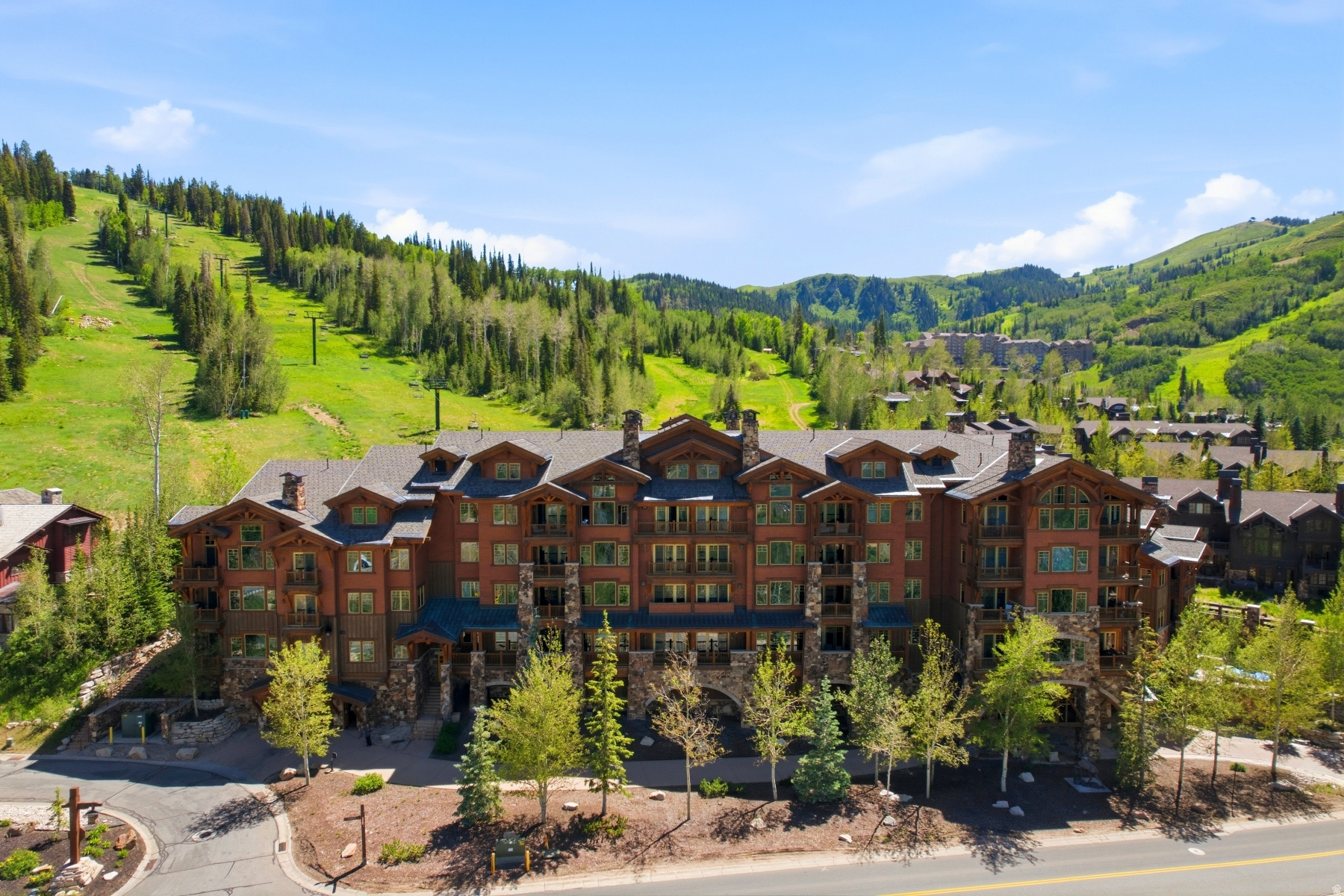 Stunning views from this 3-bedroom plus den ski in/ski out residence with full Talisker membership included!  Commanding down-valley view's set the stage for this 3-bedroom ski-in/ski-out residence, complete with a full Talisker Club Membership.  Step directly onto the slopes of Deer Valley from the Northside Express lift and experience true mountain convenience. Inside, a warm mountain aesthetic meets modern comfort-highlighted by a large great room with custom stone fireplace including an expansive chef's kitchen, both of which make entertaining for the evening seamless.  The master suite offers a luxurious retreat with its own fireplace and ensuite bath complete with radiant heat floors and a jetted soaking tub. In addition to the other two ensuite bedrooms this residence includes a separate den, that is perfect for overflow, office space or a play space for children or teens.  Step out onto the private deck to enjoy morning coffee or aprs-ski cocktails with unforgettable views.  Grand Lodge features on-site management and concierge services, owners' lounge, fitness room, ski lockers, heated underground parking, two hot tubs, and access to an on-demand shuttle via Dial a Ride for seamless access to everything Park City has to offer.  Ownership includes a full Talisker Membership, granting exclusive access to the on-mountain Tower Club, Courchevel Bistro on Main Street, the Outpost, all of Tuhaye's amenities including the signature Mark O'Meara golf course, and a year-round calendar of adventures. Offered fully turnkey-simply arrive and start living the Talisker on mountain lifestyle.