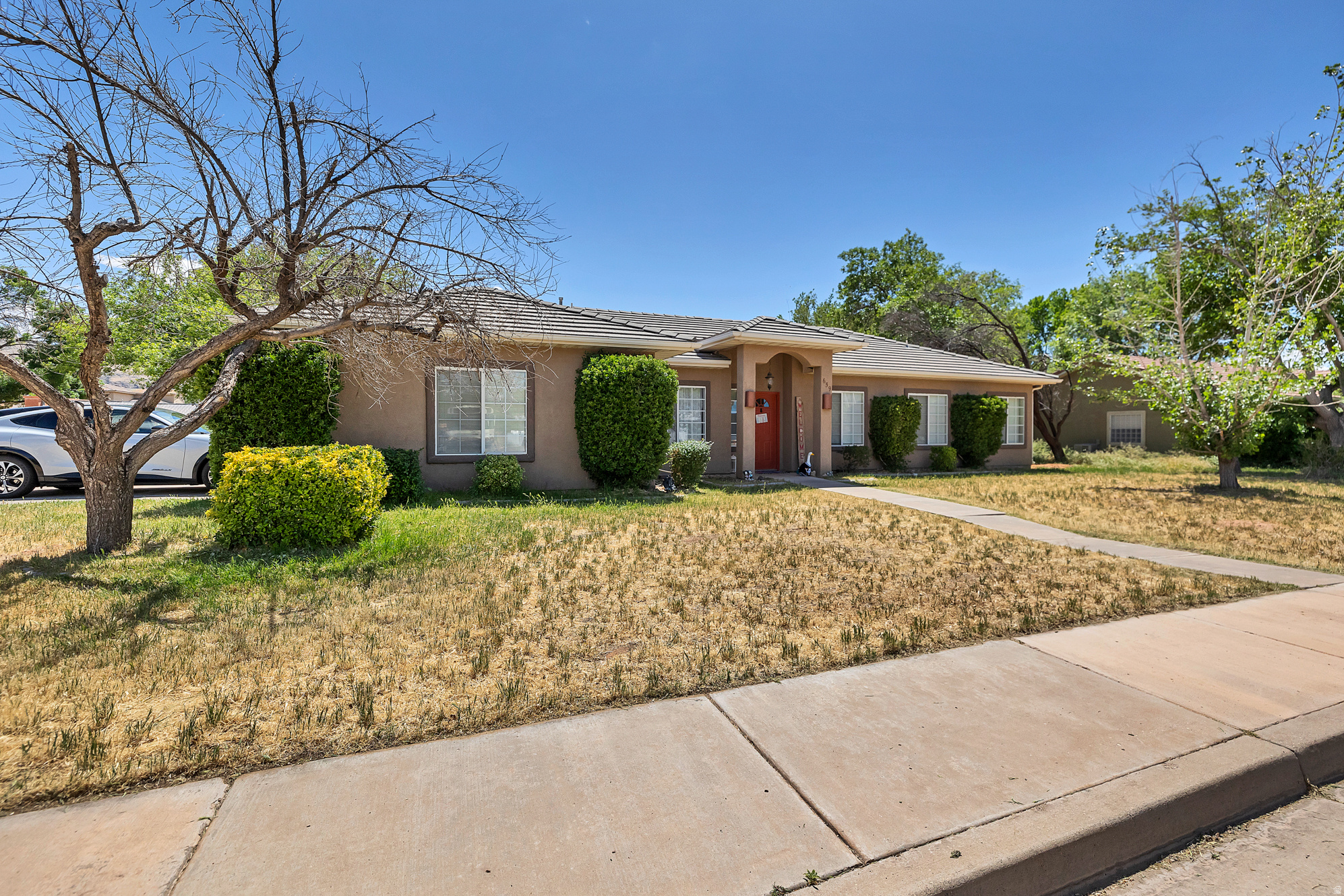 Everything a family needs to make the most of Southern Utah summers. This Hurricane gem offers 1,600+ square feet with recent updates including new flooring in the front room, guest suite bedroom, and main hall bathroom, plus all new toilets throughout. The kitchen and laundry are fully equipped with appliances under two years old, including the refrigerator, stove, microwave, dishwasher, and washer/dryer, all of which stay with the home.  Out back, the fully fenced yard with block walls on three sides offers privacy and plenty of space. A gazebo and 10x12 storage shed both convey, along with a dedicated cement pad for your RV, boat, or weekend toys. The wood-framed swing set with sandbox, platform deck, and slide is ready for the kids, and three peach trees and two cherry trees add a touch of homegrown charm. Hurricane's wide-open skies and warm climate mean this backyard gets used year-round. Come see it for yourself.  Square footage figures are provided as a courtesy estimate only and were obtained from previous listing.  Buyer is advised to obtain an independent measurement. Buyer to verify all information.