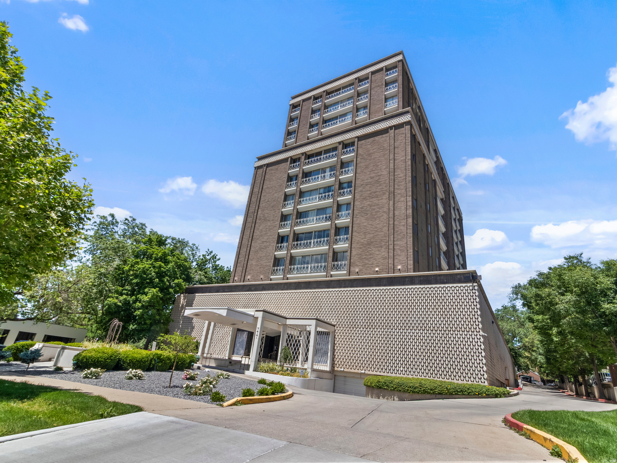 Wowser!  Welcome to one of the finest remodeled units in the 'Wedding Cake Building'-a mid century modern building with exterior breeze blocks and fanciful exterior ironwork. This condo faces east and is high up in the building with unobstructed views of the Wasatch Mountains and the University of Utah campus at the top of the hill. This means no summer heat blasting into your windows! Fully updated, with beautiful cabinetry in the kitchen with a light and open floorplan, main bedroom has a generous walk-in closet, and both bedrooms will fit king sized beds. What's unique is the all-new windows and slider/frames that most units don't have which makes the place cozy and efficient. New paint, carpet, updated appliances and cabinttry. Secure building and parking underneath (but also on a bus route downtown or to the U), nice updated pool on the 3rd floor, laundry on 2nd floor.