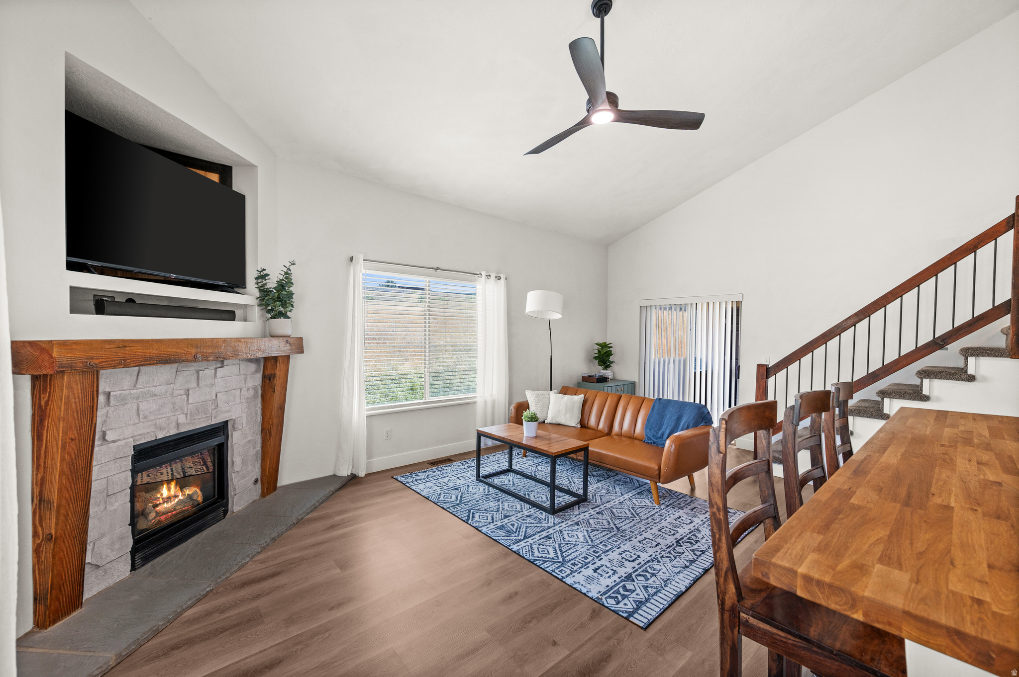 Welcome to this rare top-floor, corner condo in Jefferson Place. This beautifully updated two-story condo offers space, privacy, and character that are hard to find in the complex. Vaulted ceilings, natural light, fresh paint, new LVP flooring, new ceiling fan, and a cozy gas fireplace create an inviting main living area. The kitchen features granite countertops, backsplash, new stainless appliances, updated cabinetry, and a rare large pantry. Two bedrooms and a full bath are on the main level, while the upstairs primary suite offers recessed lighting, a walk-in closet, and an updated bath with a brand-new walk-in shower. An upstairs flex room is ideal for an office, hobby room, gym/yoga space, or storage. The private covered balcony overlooks peaceful open space. Includes garage parking, two storage areas, updated living room windows, 2021 roof, and 2021 furnace/AC. Enjoy pool, hot tub, tennis, gym, sauna, clubhouse, RV parking, beautiful grounds, and HOA-covered water/sewer/trash/snow removal. Close to I-15, shopping, dining, airport access, downtown SLC, and canyon recreation. Don't miss this opportunity to own a move-in ready condo with standout updates, peaceful privacy, and an unbeatable Sandy location. Some photos have been virtually staged to show possible use of space.