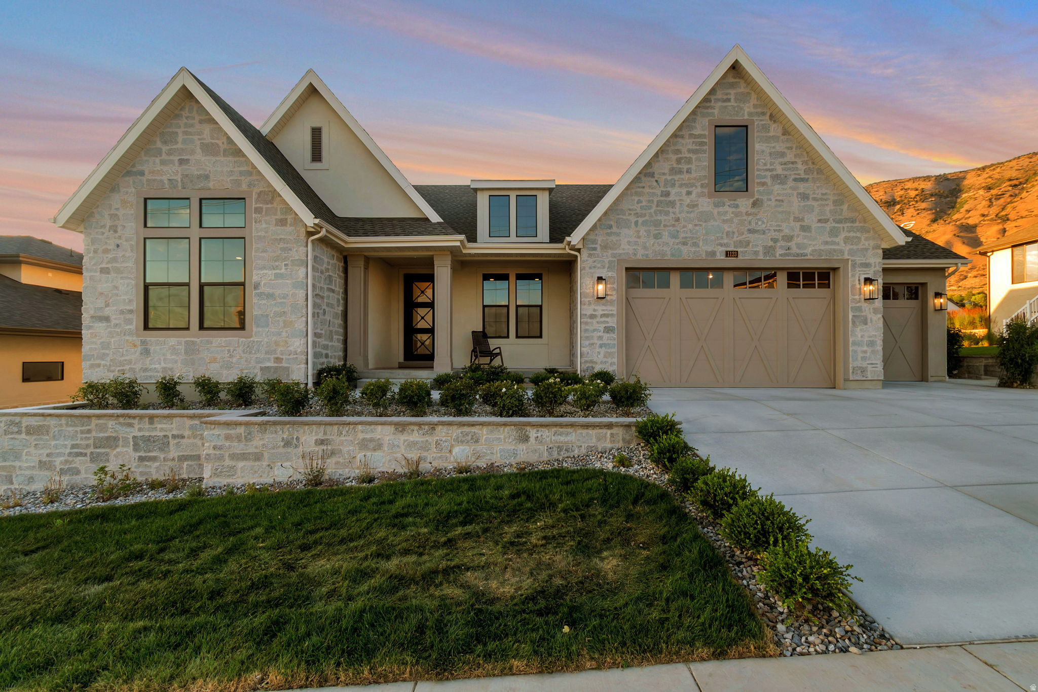 LOT#106. This stunning "Treble XL" nestled on the east bench against Mt. Timpanogos has awesome and timeless curb appeal with Symphony Homes' new "European Romantic" exterior, and tons of upgrades throughout this very popular and spacious floorplan! Quality wide-plank LVP flooring, extra high ceilings and vaulted ceiling in the family room with stain grade beams. Kitchen has upgraded appliances, including 48" dual fuel gas range, built-in column fridge & freezer with panels. Walk-in butler's pantry with countertops and outlets. Huge dining nook surrounded by large windows. Large laundry room includes ample cabinetry & countertop. Primary suite has a recessed tray ceiling w/ crown and features a huge custom walk-in closet, and an elegant bathroom! Second bedroom on main level has a unique feature of a vaulted ceiling and its own en-suite bathroom! You'll love entertaining in the finished basement featuring a beautiful wet bar. Lots of storage space throughout including a dedicated finished storage room with shelving. Garage is finished with epoxy flooring, and the 3rd stall is 40' deep! Large covered patio, and spacious backyard to enjoy the gorgeous views. Amazing craftsmanship and interior design throughout.