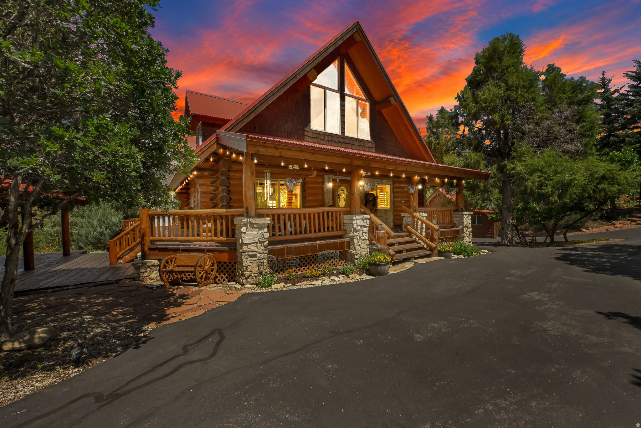 Tucked away on an exceptionally private double lot of nearly two acres in a quiet cul-de-sac, this one-of-a-kind custom log home is a truly magical mountain retreat. Surrounded by towering pines, aspens, and junipers, this extraordinary property offers the perfect balance of peaceful seclusion and convenient access, located just minutes from the entrance of the gated Timber Lakes community. Built with impressive hand-peeled logs and exceptional craftsmanship throughout, this immaculate home radiates timeless rustic elegance while offering the modern comforts of luxury mountain living. The inviting interior features soaring vaulted ceilings, stunning hardwood floors, gorgeous wood shutters, granite countertops, new stainless steel appliances, and a spacious main-level primary suite. A walk-out basement provides additional living space, abundant storage and seamless access to the outdoors. Step outside to the expansive wraparound deck or relax in the included hot tub while taking in the tranquil forest surroundings. The beautifully maintained grounds also feature a flagstone patio, garden area, powered storage shed, paved circular driveway and extensive parking. Outdoor adventurers will appreciate the incredible six-car garage with oversized RV-height doors, while three buried 1,000-gallon propane tanks provide outstanding convenience for year-round living. Additional upgrades include recently treated and stained exterior logs, a new garage door, a water softener, a reverse osmosis water filtration system and solar panels for improved energy efficiency. Furnishings are negotiable, making this remarkable property an exceptional opportunity for those seeking a turnkey mountain escape. Every detail has been thoughtfully designed and meticulously maintained, creating a warm, inviting home that perfectly captures the beauty, serenity and lifestyle of mountain living. Unlimited recreational activities, including fishing, boating, world-class golf, phenomenal skiing, epic snowmobiling, hunting, and ATV-ing, are all at your fingertips! All of the wonderful amenities of the Heber Valley & Park City are only minutes away!