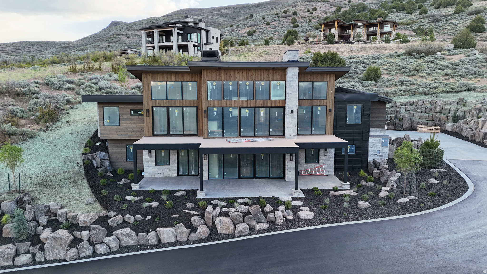 Setting the gold standard and second to none, this beautiful and luxurious home will be completed August 2026! With incredible views, a secluded, private back yard and an incredible design package this home will not only impress but will dazzle you with its beauty! The main floor features an astounding open space with a gorgeous open flame fireplace creating the perfect space for entertaining. The expansive deck flows from the interior to create a unique indoor/outdoor experience overlooking the captivating valley and mountains below. With strategic planning the home was carefully designed and placed to maximize views and avoid unwanted sun glares. The oversized master bedroom captures the incredible views with a gorgeous ensuite bathroom. With a luxurious plaster finish, a beautiful lighting package and enhanced modern earth tone details this master suite truly is a modern luxury. Additionally, the main floor features a gorgeous secluded and private back yard. Perfect for late night fire talks and games with the kids. An office or guest suite adjacent to the master completes the main level. Going downstairs you will find an additional master suite and 3 bedrooms suitable for your entire family. An added space perfect for an in-home golf simulator, theater or gym awaits your final decision. The walkout basement captures similar jaw dropping views that give a euphoric ending to any day. This paramount home, second to none is scheduled for completion in August 2026 and will be MOVE IN READY just in time to enjoy all the wonderful holidays here in the Wasatch Back. A FULL GOLF MEMBERSHIP AVAILABLE WITH PURCHASE