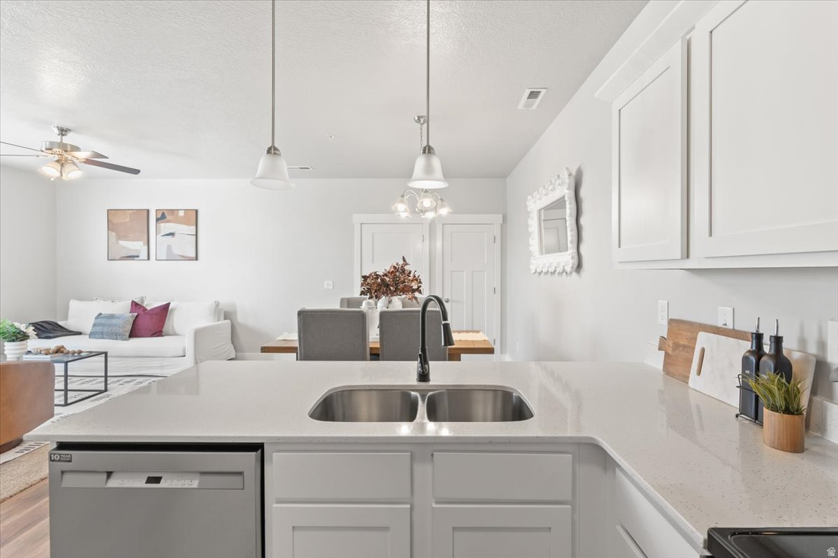 PRICE IMPROVEMENT- One of the cleanest units in the complex and great mountain views!  Welcome home to comfort, convenience, and style in this beautifully designed 3-bedroom, 2-bath modern condo! Built in 2020, this home offers 1,272 square feet of light-filled living space designed with an open-concept layout that seamlessly accommodates both lively gatherings and peaceful everyday living. The condo has all new luxury laminate flooring and carpet throughout and one of the nicest condos on the market! The vast laundry room, pantry, and storage space, gives you plenty of room for your belongings to be kept organized. Step into the kitchen, where white shaker cabinets and sleek quartz countertops create a sophisticated atmosphere. Condo has new water softener, new dishwasher, disposal and kitchen faucet. With ample prep space, it's the ideal setting for entertaining friends or enjoying intimate dinners. Transition effortlessly to your covered patio, and relax with mountain views enjoy your casual summer grilling spot. This condo has been well cared-for and it shows! Additional highlights include a private garage with a full driveway, a spacious primary suite with an ensuite bath, and all appliances are included with the sale. Residents have access to the community clubhouse, pool, and playground, and the location is convenient to shopping, dining, and transportation routes. Whether you are looking to downsize, invest (long-term rentals allowed), or purchase your first home, this condo offers low-maintenance living with modern features. ** Listing Incentive: Receive a free 1-0 buydown, giving you a 1% lower interest rate for the first year. Incentive offered by Nikko Denis at Intercap Lending. Terms and conditions apply. Buyer must qualify. Rates subject to change without notice.** Call us today to schedule your showing!