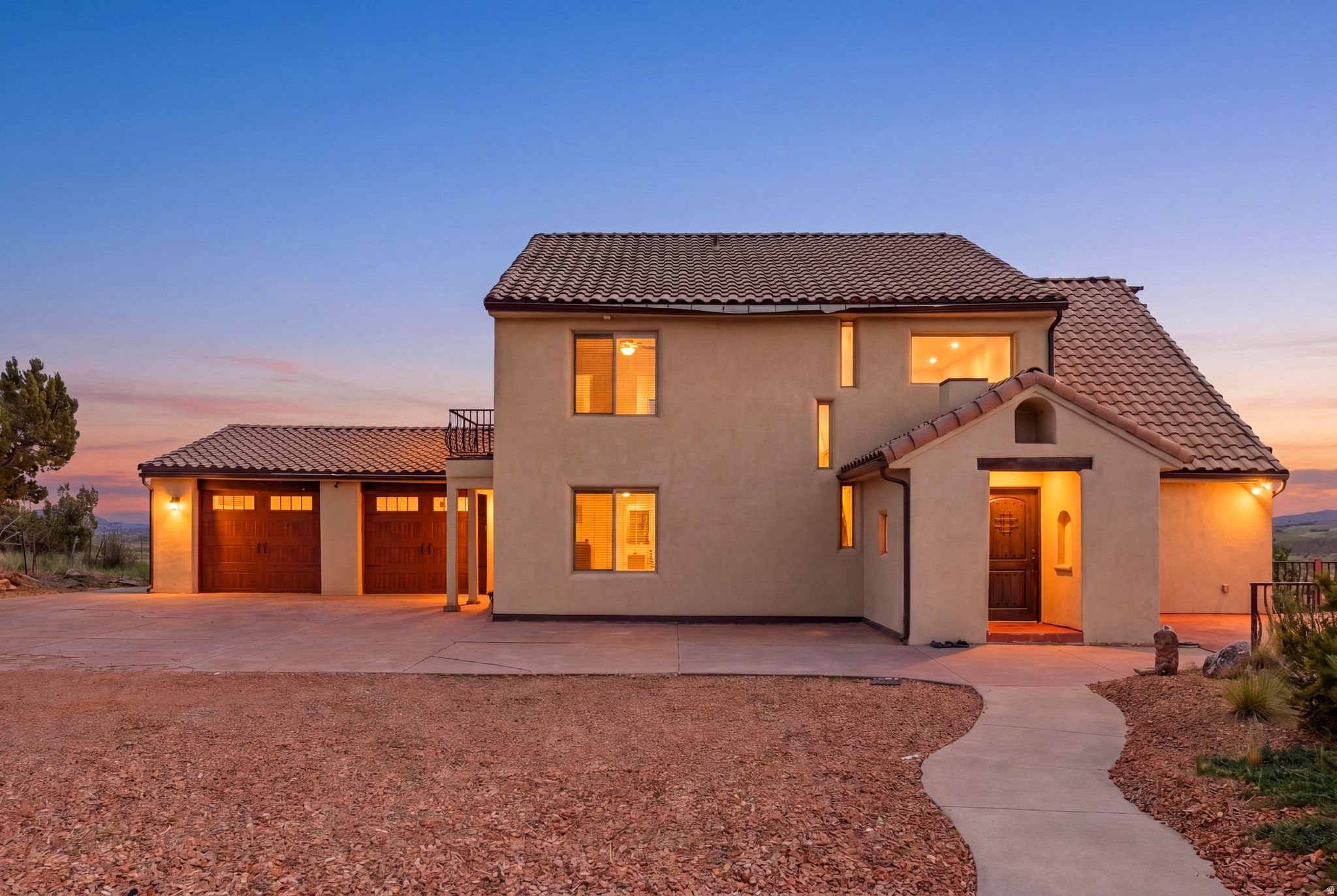 Escape the pace of city life and discover a peaceful retreat in beautiful Alton, Utah, where breathtaking views, quiet surroundings and outdoor adventure come together. Set on a 1.65-acre lot and offering 4,357 square feet, this unique five-bedroom, four-bathroom property is thoughtfully designed for gathering, relaxing and making lasting memories. The main level welcomes you with a foyer entry, vaulted great room filled with natural light, a fireplace, semi-formal dining area and an open kitchen with pantry, offering plenty of space to cook and entertain. Just off the kitchen, the laundry/mudroom features a stackable washer and dryer, sink, storage closet and sit-down bench with convenient access to the two-car garage. The main-level owner's en-suite includes a walk-in closet, while a powder bath adds everyday convenience. Step outside to the expanded balcony and take in the serene, wide-open views.  Upstairs, a loft-style entertainment area offers another inviting place to unwind, complete with walkout access to a private balcony where you can relax and enjoy the scenery. Two additional bedrooms are connected by a Jack-and-Jill bathroom, creating a comfortable and functional layout for family or guests. The lower level is built for fun and flexibility, featuring a spacious living room with a second fireplace, pool table, second kitchenette with pantry/storage, stackable washer and dryer, two bedrooms, a full bathroom and an additional bunk room or flex space. Walk out to the backyard and enjoy the hot tub, grass area, fire pit seating, playground and unforgettable views, perfect for quiet evenings, roasting marshmallows under the stars and hosting friends and family.  With mini-splits for heating and cooling throughout, radiant heat, a two-car garage with storage and access to the backyard and mudroom, this home offers comfort in every season. Located within driving distance to Dixie National Forest, hour to Brian Head Ski Resort, hour to Cedar City, hour and forty-four minutes to St. George and countless outdoor recreation opportunities, this property is ideal for those looking to bring their Razors, outdoor toys and sense of adventure. With nightly rentals allowed, this one-of-a-kind Alton retreat offers the perfect blend of peaceful personal escape, guest-friendly design and investment potential.