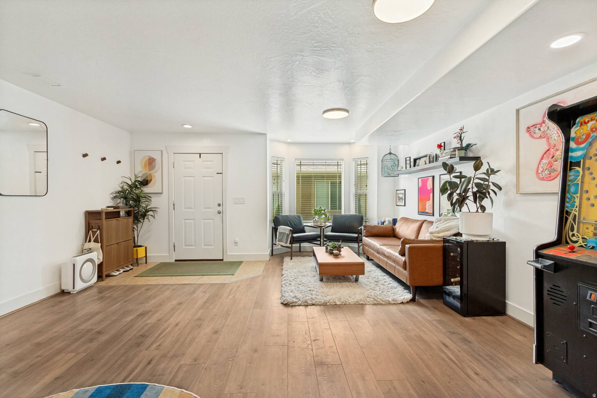 **BEAUTIFUL 3-BEDROOM, 2.5-BATH TOWNHOME IN THE HEART OF LEHI!**  Bright, updated, spacious, and truly move-in ready. This is the affordable townhome you've been waiting for! Upstairs, you'll find generously sized bedrooms, including a spacious primary suite with vaulted ceiling, designed for comfort and relaxation. Master Bathroom remodeled this year, along with full HVAC system installation in 2023. Humidifier and air purifier added in the HVAC install. Fresh interior paint and updated flooring give the home a clean, modern feel, making it ready for its next owner.  The functional floor plan (including both a living and family room) offers plenty of space for everyday living, entertaining, or simply relaxing at home.  Perfectly located just minutes from schools, dining, Silicon Slopes, I-15, and Thanksgiving Point, this home is an excellent opportunity whether you're searching for your next primary residence or a smart investment property.  Enjoy the added privacy of a **fully fenced backyard patio** with convenient gated rear access to a community park. The one-car garage features built-in shelving and generous storage space, while the HOA takes care of the community landscaping-giving you more time to enjoy your home instead of maintaining it. There is also a dedicated spot for parking outside of the garage. **More photos and additional updates coming soon!**  Don't miss this opportunity to own a beautiful townhome in one of Lehi's most convenient locations!