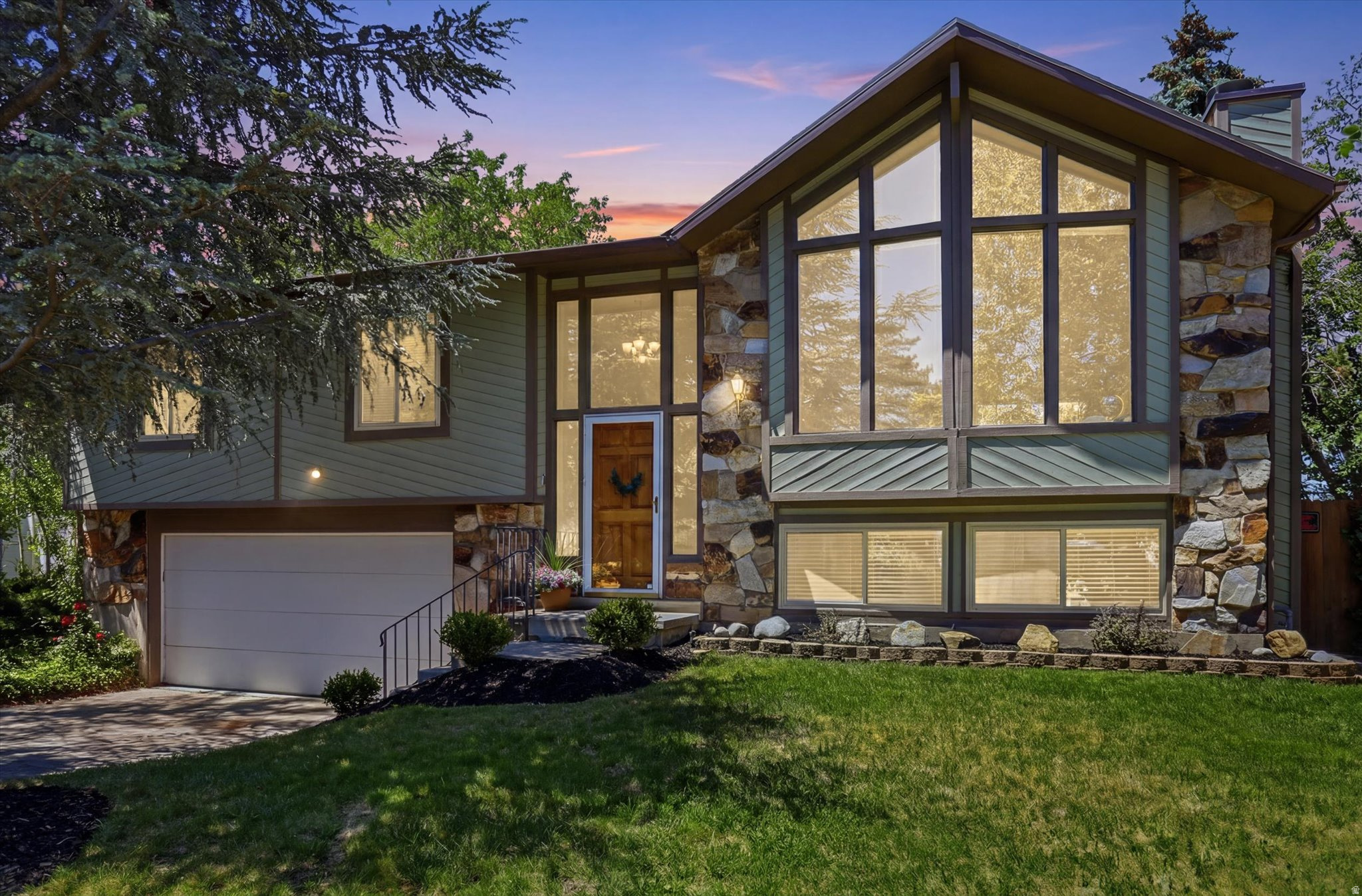 Location, location, location! Beautiful East Sandy home in a highly desirable area with convenient access to the mountains, including Snowbird and Alta, making it an ideal location for year-round outdoor recreation. Located within the boundaries of some of the highest-rated schools in the state, this home offers an exceptional combination of location, lifestyle, and convenience. This 4-bedroom home features many updates throughout, including a remodeled kitchen with quartz countertops, upgraded appliances, and updated flooring. The functional split-level layout offers two separate living rooms, providing plenty of space to relax, entertain, or gather with family and friends. The main living room is highlighted by floor-to-ceiling windows that fill the space with natural light and showcase the mountain views. The walk-out basement adds flexibility and easy access to the backyard. Outside, you'll find a large deck that is perfect for gathering, entertaining, or simply relaxing. The mature trees throughout the yard provide excellent privacy and shade, creating an inviting outdoor space to enjoy. Come see this beautiful home before it's gone!  Square footage figures are provided as a courtesy estimate only and were obtained from county records.  Buyer is advised to obtain an independent measurement.