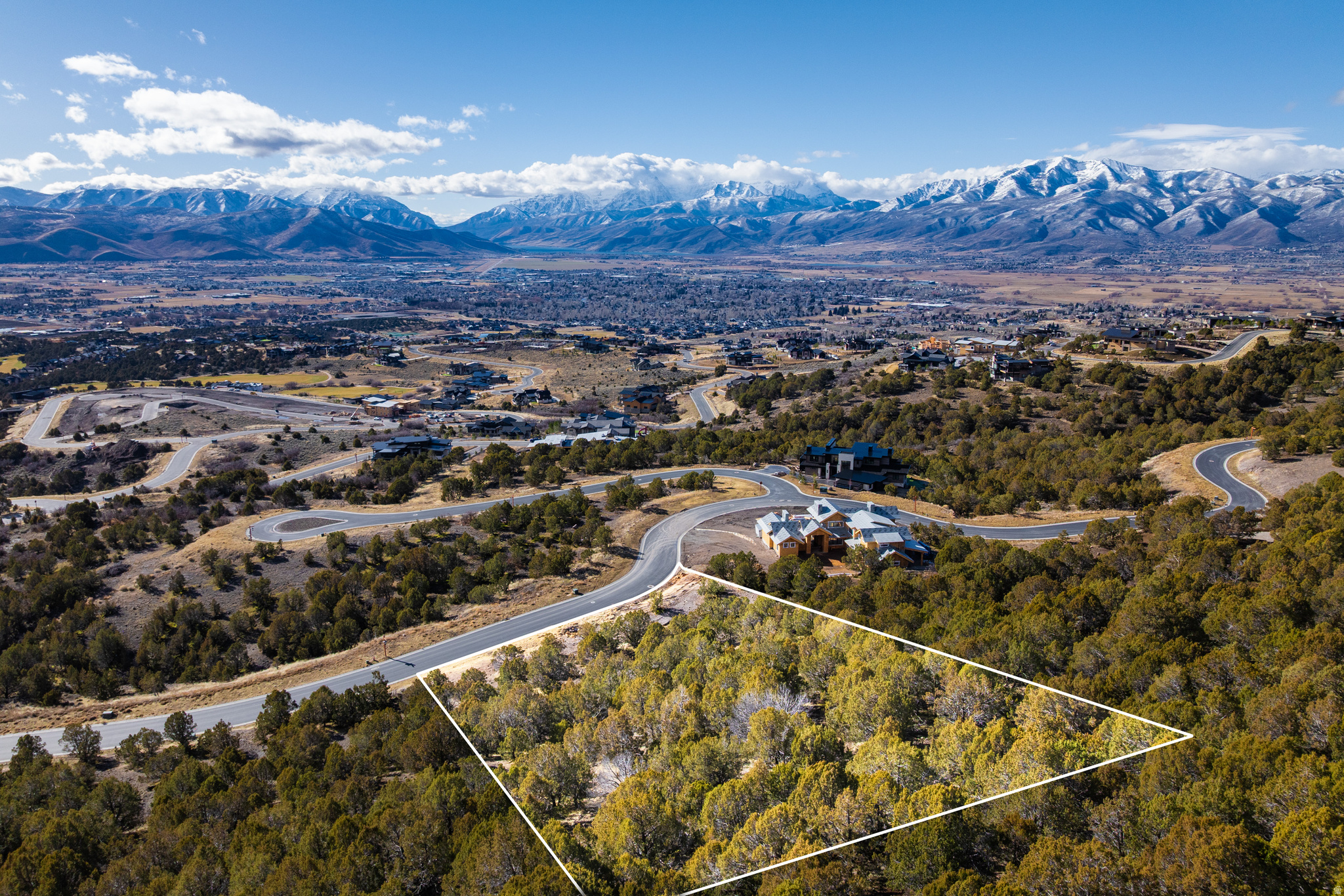 Premier Crown Ridge homesite at the top of Red Ledges with sweeping views of Mt. Timpanogos, the Wasatch Back, Deer Creek Reservoir, and Heber Valley. Enjoy Red Ledges' world-class golf, resort amenities, and private Deer Valley ski lounges.