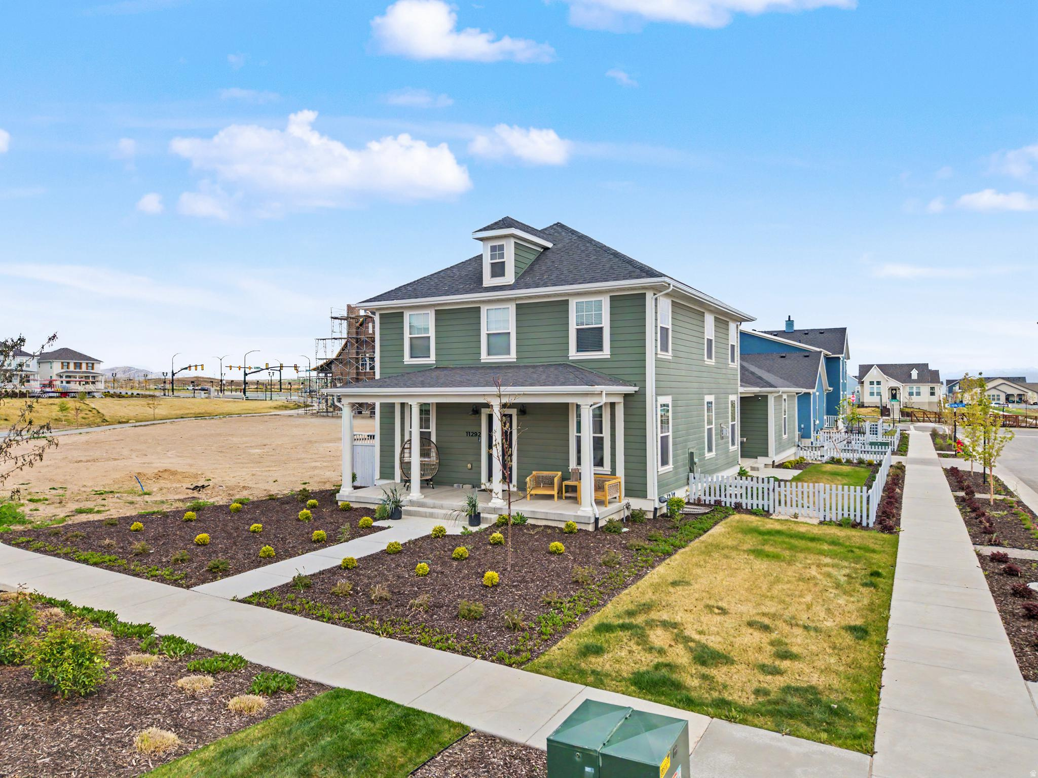 This beautiful, immaculate new home sits on a premium corner lot, offering mountain & water views along with surrounding space-one of the only homes in the area without a neighbor right next door. Designed for both comfort and entertaining, the spacious basement features an incredible wet bar & gathering space. You'll find a thoughtfully designed layout with 4 bathrooms (3 full), a double oven in the kitchen, huge quartz kitchen island, convenient mudroom, and a generous walk-in closet. The 3-car garage provides ample storage and parking, while fiber internet ensures fast/reliable connectivity. Located in an amazing community with friendly neighbors, just minutes from popular spots like Swig, coffee shops, and other local favorites. Enjoy relaxation, convenience, and lifestyle. Right next to Watercourse Pond.  2 INSTANT TANKLESS WATERS! Automatic sprinkler system.  Buyer to verify all info/square footage.