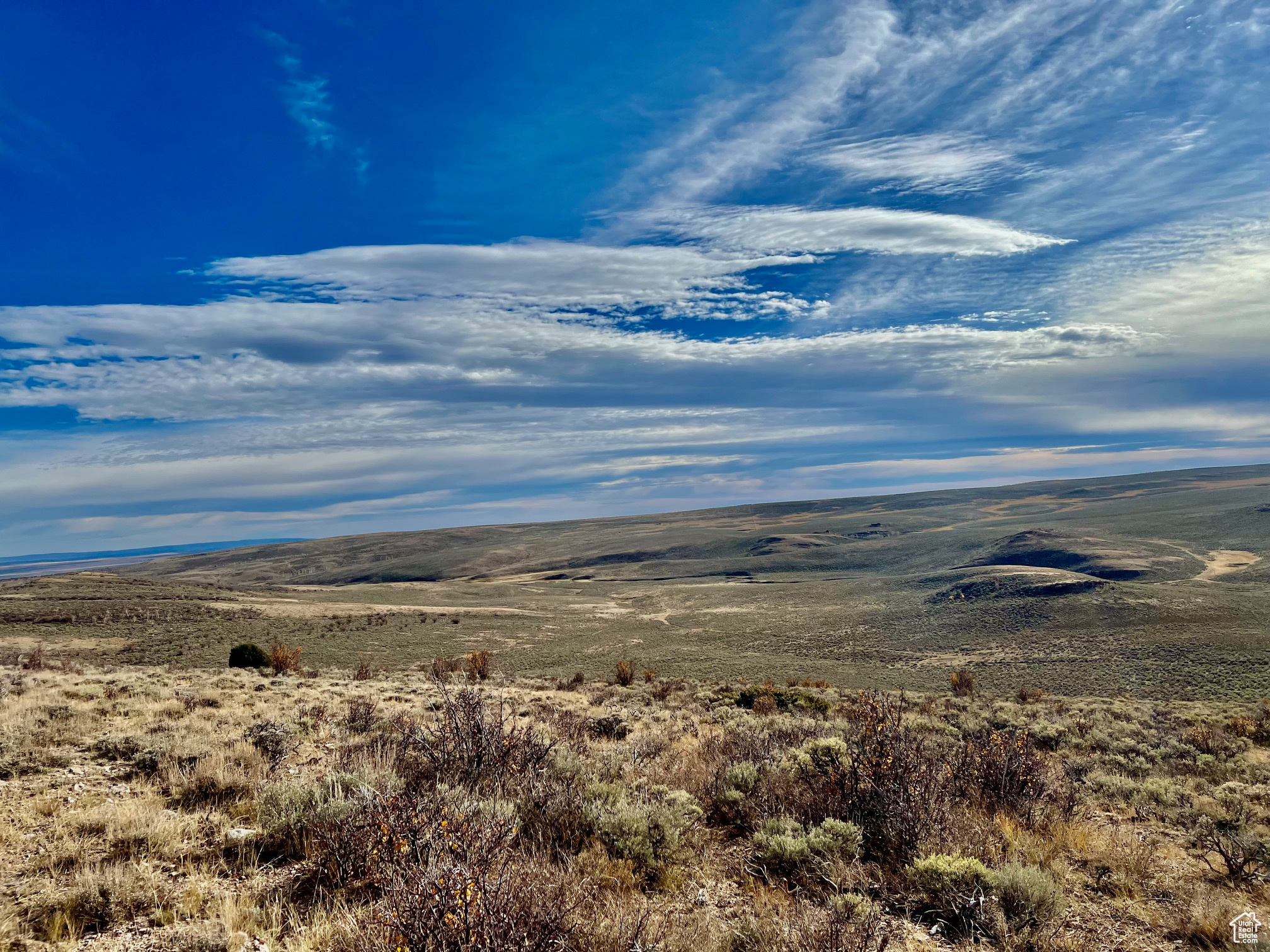 Discover the ultimate getaway on Diamond Mountain, where 1,141.61 acres of unspoiled beauty await! This expansive property is made up of 8 parcels, offering a rare blend of rustic ridges, rock formations, open draws, rolling hills and tree-lined vistas. A scenic pond, two natural springs, and a well provide abundant water sources. A cozy cabin with breathtaking views awaits some TLC, providing the perfect retreat from the everyday grind. Ideal for nature lovers and outdoor adventurers, the land is rich with wildlife, from deer and elk to sage grouse. This mountain haven is well-suited for grazing livestock, fully fenced, with power on-site, abundant water, and multiple access points. Whether you're looking to expand your cattle operation or carve out a personal sanctuary in the mountains, this is your chance! Don't miss the rare opportunity to own a piece of Diamond Mountain's untouched beauty. Acreage per county records. Buyer advised to verify all information including acreage.