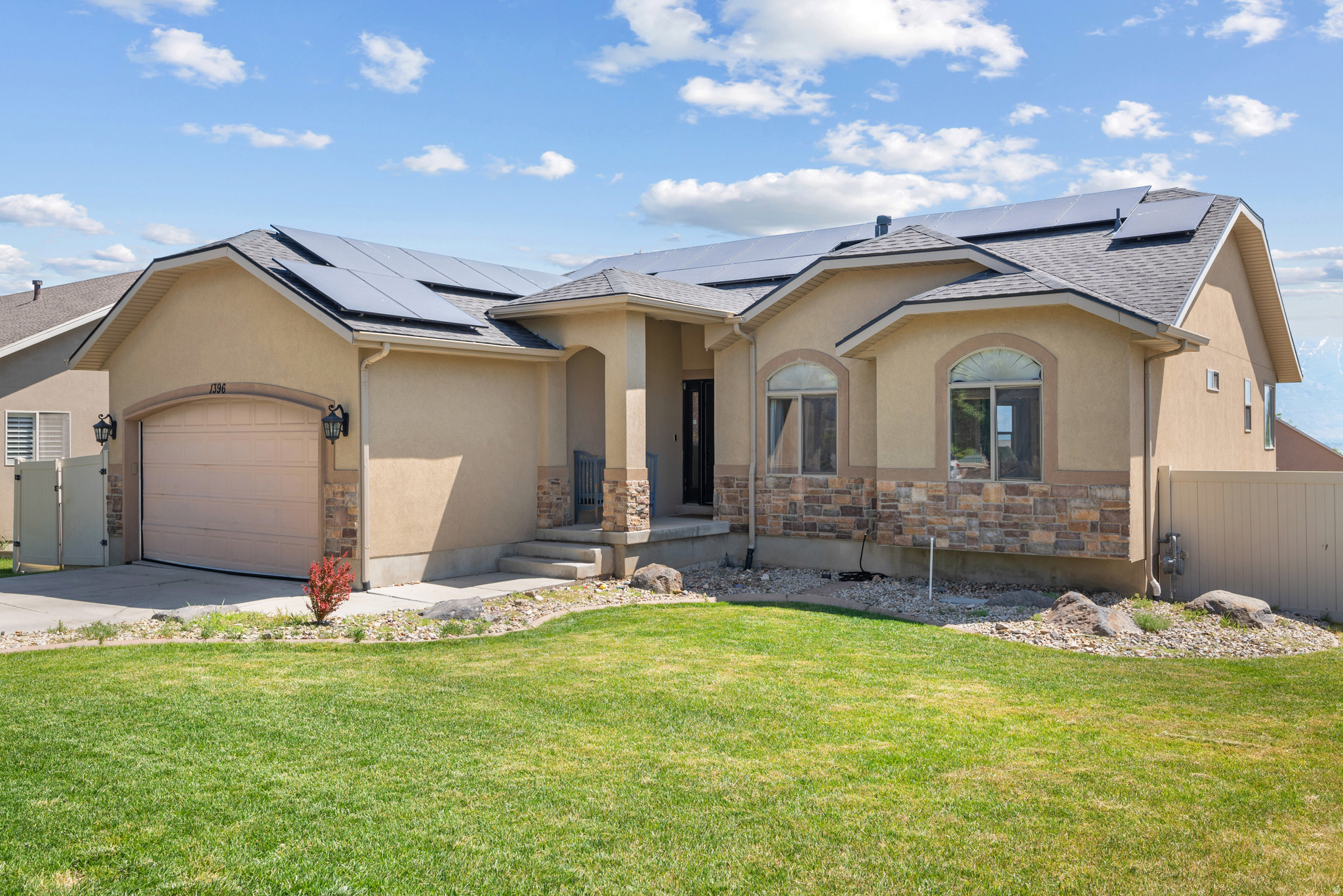 Welcome to this amazing 5-bedroom, 2.75-bath home with nearly 3,000 sq ft of space ready to provide the space needed to build long lasting memories with family and friends. Built in 2003 on a 0.19-acre lot, this home offers a comfortable main-level living open family room anchored by a cozy gas fireplace, a functional kitchen and dining area, and easy access out to the deck overlooking the lake and mountains. Daylight basement with natural light opening directly to the backyard, making it feel more like an extension of the main level. Storage available in the basement, attached 2-car garage, and in the outdoor storage shed, giving you places to keep seasonal items, gear, or tools out of the way but easy to access. Home has a solar system designed to help offset electrical costs, central heating and air for year-round comfort, and a brand new water heater for added reliability. If you've been looking for a Saratoga Springs rambler with views, separate living spaces, and thoughtful extras like solar and a theater area, this home might fit what you've been hoping to find. Square footage figures are provided as a courtesy estimate only and were obtained from county records. Buyer is advised to obtain an independent measurement.