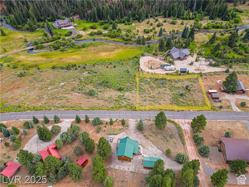 Calling all adventurers! This flat, build-ready lot in Aspen Highlands is your base camp to endless exploration. With Mammoth Creek rushing just behind the property and epic mountain views in every direction, nature surrounds you at every turn. Nestled among rustic cabin homes with easy, year-round access off a paved road, you're perfectly positioned for adventure. Just minutes from Panguitch Lake, Brian Head, Duck Creek Village, and the red rock wonder of Bryce Canyon, this is where your wild journey begins. Build your escape, and let the mountains call you home.