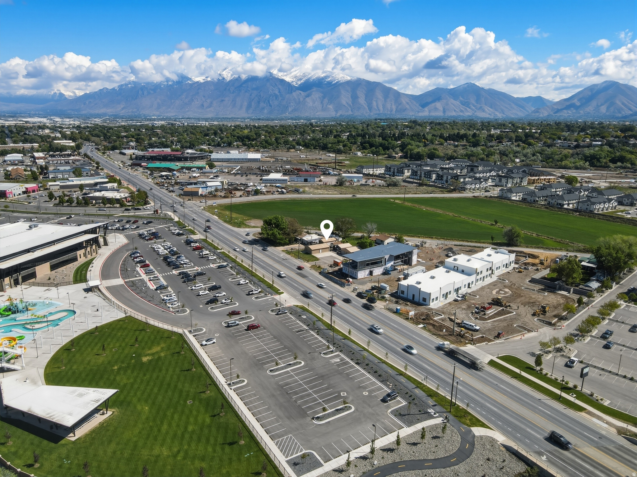 Prime Development Opportunity in Spanish Fork  1.0067 Acres This unique property, shall include MLS: 2156946, offers an exceptional investment opportunity in one of Spanish Fork's most dynamic growth corridors. The list price includes both parcels totaling 1.0067 acres. Strategically located just east of the new Spanish Fork Fit City Recreation Center and just south of the Spanish Fork Fairgrounds, the property sits in a highly visible and accessible area surrounded by commercial development.  Just a short walk to the Spanish Fork River Trail and Sports Complex, the location delivers outstanding convenience and lifestyle appeal. Whether you're looking to develop retail, office space, mixed-use, or another compatible project, this property provides endless possibilities and the uncommon opportunity to help shape the future of Spanish Fork. Don't miss this versatile investment with strong upside in a prime location. Contact us today for more details or to schedule a showing.