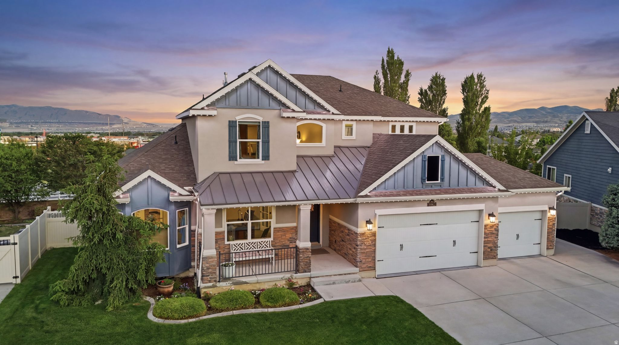 Beautifully maintained South Jordan home offering over 5,100 sq ft with 6 bedrooms, 3.5 bathrooms, incredible views, and exceptional indoor and outdoor living. Located in a mature neighborhood with no backyard neighbors, this property offers privacy, space, and versatility in one of South Jordan's most convenient locations.  Inside, you'll find vaulted ceilings, granite countertops, an 18-foot living room ceiling with a large fan, spacious gathering areas, and an ideal layout for both entertaining and everyday living. The home features two offices, one on the main floor and one in the basement, along with three laundry rooms conveniently located on every level. A fully equipped mother-in-law apartment with a separate daylight walkout basement entrance includes a second kitchen and large windows that fill the lower level with natural light, creating excellent flexibility for multigenerational living, guests, or rental potential. Recent updates include a new A/C unit installed 2 years ago, repair and servicing of the second A/C last year, recently inspected furnaces, a new water heater, new water softener, upgraded carpet and padding, and new Cortec 100% waterproof flooring on the main floor and basement. Additional features include central vacuum, acrylic garage flooring, lifetime warranty on all windows and the sliding door, and excellent insulation contributing to lower-than-average utility bills. The finished garage features above-garage storage and two garage door openers, including one with smart phone operation. The backyard is designed for both recreation and relaxation with a lighted basketball/pickleball court, mature peach and nectarine trees, vegetable garden area, children's play area with swings and slide, fully fenced yard, masonry privacy wall, covered patio, and a large deck overlooking the backyard and valley views. Permanent exterior decorative lighting adds to the home's curb appeal year-round. Enjoy quick access to Bangerter Highway, shopping and dining at The District, nearby parks and trails, and a paved pathway connecting the neighborhood to the lake at Daybreak. The Oquirrh Mountain Temple and LDS church are conveniently located nearby. Rare opportunity to own a spacious and thoughtfully updated property with incredible amenities, stunning views, and versatile living options in one of South Jordan's most desirable areas. Square footage figures are provided as a courtesy estimate only and were obtained from county records.  Buyer is advised to obtain an independent measurement.
