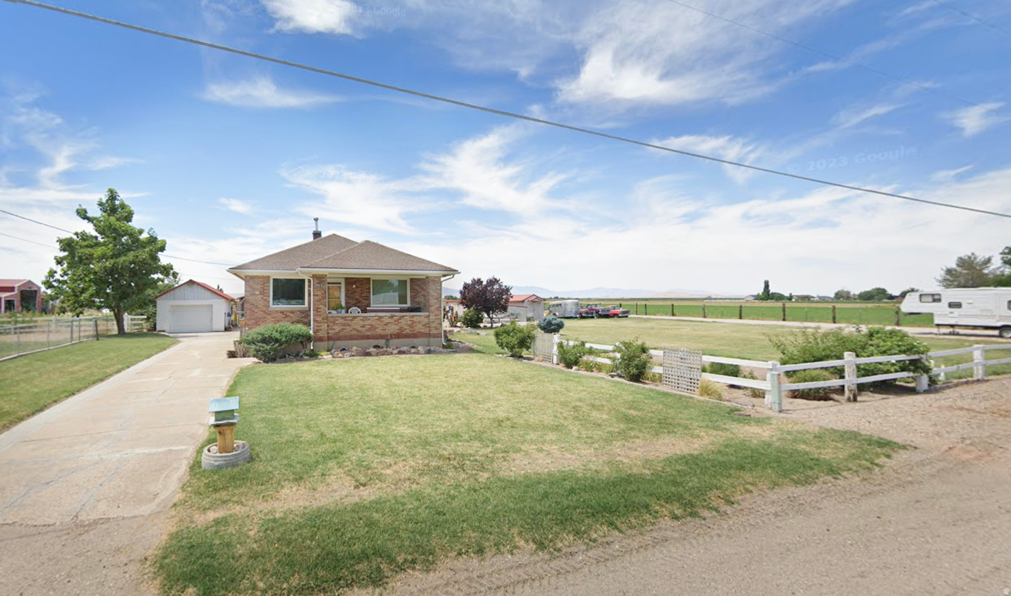 Back on the market due to a change in buyer financing circumstances, no fault of the property. A rare second chance to own this exceptional property! Discover an exceptional opportunity to own a charming horse property in the heart of peaceful Hooper, just moments from the rodeo grounds and tucked along a quiet rural road. This inviting setting offers the perfect blend of rural tranquility and everyday convenience. The home is filled with warmth and timeless character, offering a welcoming space that is move in ready. The upper level features a comfortable living room along with a cozy sitting area centered around a gas fireplace, creating the perfect place to unwind after a long day. Two bedrooms and one full bath complete the main level. Downstairs, you will find an unfinished bedroom and additional space ready for your personal touch, providing the opportunity to expand and create something truly your own. Outside, mature trees and established rose bushes create a picturesque and peaceful backdrop. Permanent Jellyfish Holiday lighting adds a festive touch year round with customizable seasonal colors. The property is exceptionally functional for the equestrian and animal enthusiast, featuring irrigated pasture, a 15x10 horse lean to shelter, wash rack with horseshoeing hitching post, hay storage shed, garden area, and chicken coop. A one car garage with attached shop, covered carport, and dedicated dog run provide added versatility. There is also generous space to easily accommodate parking for horse trailers, RVs, and recreational vehicles. A brand new furnace, less than one year old, offers added comfort and peace of mind. This is a rare opportunity to enjoy refined country living with an ideal animal setup in one of Hooper's most desirable rural locations. Square footage figures are provided as a courtesy estimate only. Buyer is advised to obtain an independent measurement.