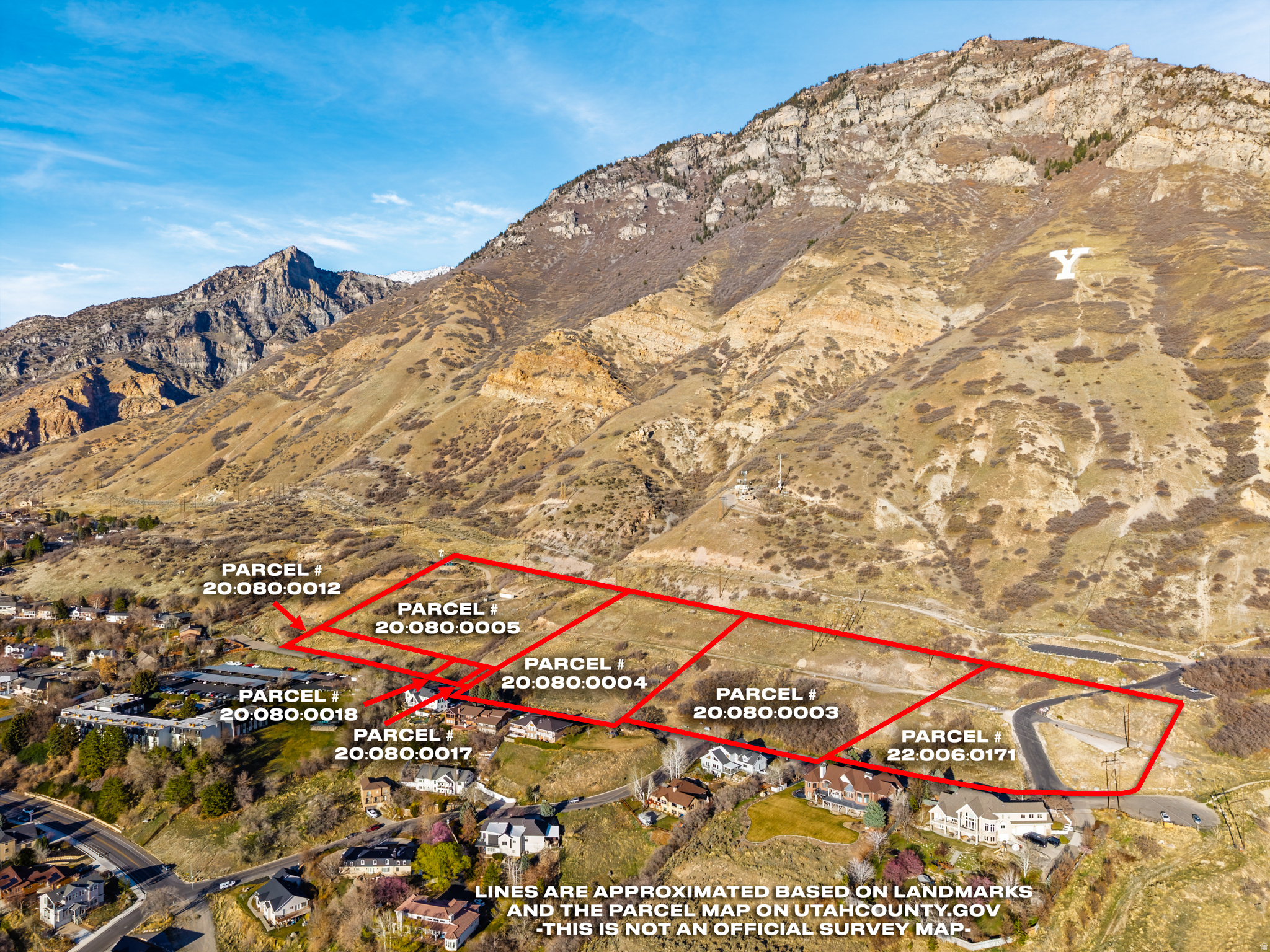 13.7 Acres close to BYU campus and the "Y" with incredible views of Utah Lake. It is currently agricultural property, but could potentially be rezoned into several residential lots. Sold as raw land, and it currently has a cell tower lease. Price is $73,000/acre or $1,000,000 total price, and consists of 7 parcels being sold together. Power sewer, telephone & water are all available in the lower Terrace Dr. street and in some places power boxes & phones on site.  The City seems to prefer the idea of 1-2  homes built on this land will not allow a subdivision.