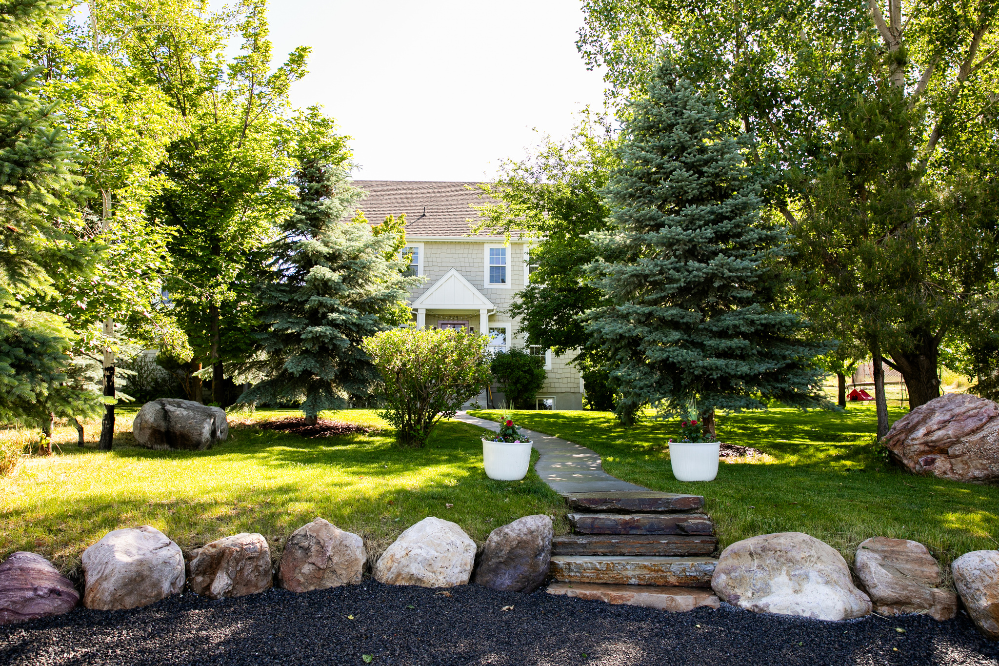 Welcome to your private retreat!  This spacious home sits on over a half-acre of beautiful, secluded property, surrounded by mature trees that offer privacy & a peaceful setting.  Enjoy the lovely valley & mountain views.  Inside, you'll find many upgrades, including quartzite kitchen counter tops, stunning antique doors + beautiful hardwood floors.  The well designed floor plan provides ample space for family living, entertainment, & guests.  Outside provides endless possibilities for gardening, recreation, & outdoor enjoyment, + plenty of RV and extra parking.  If you're looking for privacy, space, beautiful scenery, & nice upgrades, this one-of-a-kind home delivers it all.  Don't miss out! Buyer to verify all information.  Seller requires 4 hour notice for showings and would like to do a possible short term, rent back option until sellers move out of state.  Please remove shoes or put on shoe covers provided.