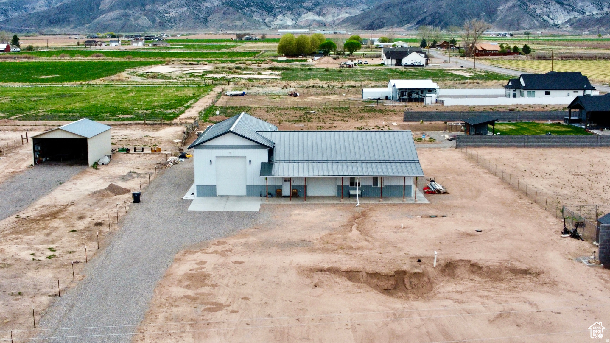 This property comes with a new shop/RV/Living space combo, move-in ready. Store your belongings, pull through garage with full hook ups, and a large shop/ living area.  The build site includes water, power, gas, and a geo-thermal system that is amazing. This building is 3500 sq ft and includes geo-thermal heat/air with 2 separate heat pumps that keeps the RV area, shop, and living area fully climatized. The building is complete with a certificate of occupancy, having a living/kitchen area, bath/laundry area, utility room, and bedroom. The building is wired for 50 amp & 220 volt outlets, and the RV pull through has it's own dump station. There is also some extra building materials that go along with this purchase. This is a great opportunity to design your own living style. Buyer and agent to verify all listing information.