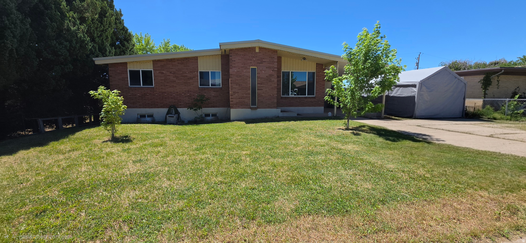 Beautiful Rambler style brick home with many upgrades. 5 bedroom 2 bath with Brand New Carpet throughout. New roof, electrical panel, whole home water filtration and 1 yr old water heater. Quiet neighborhood that is close to freeway, hospital and restaurants. Walkout basement for potential access and modification for ADU. Must see!!