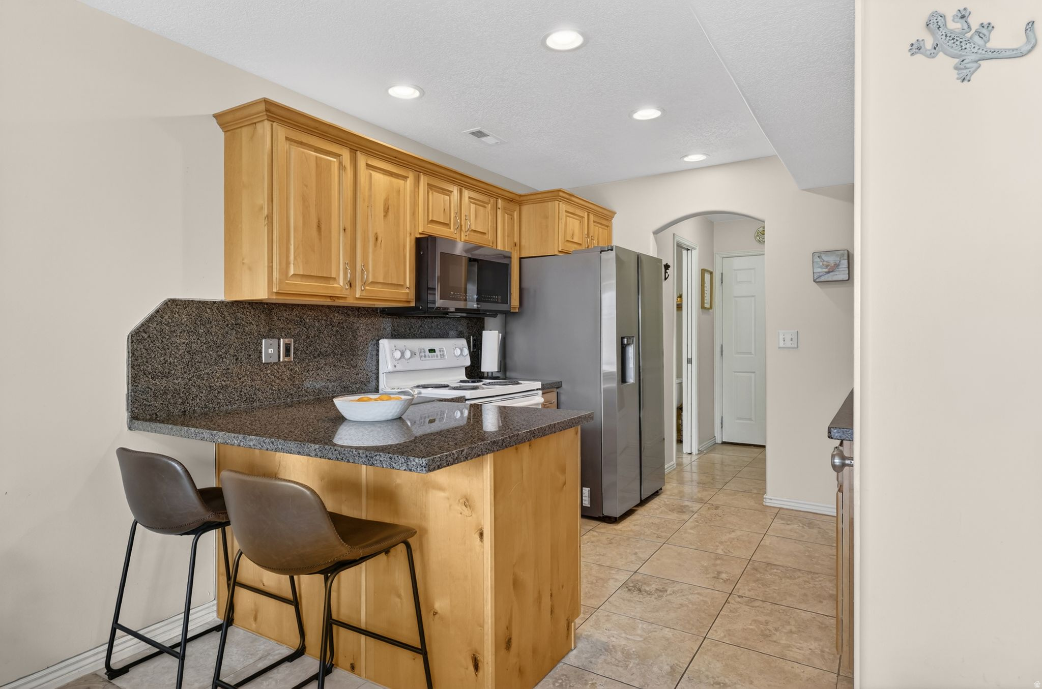 Updated and move-in ready townhome in a convenient Clinton location! This clean, low-maintenance home features granite countertops, stainless appliances, fresh paint, and an updated walk-in shower. The open floor plan offers comfortable living with just the right amount of space, while the private fenced patio and small yard provide room to relax without the upkeep. Attached garage, dedicated laundry room, and easy access to shopping, dining, and commuter routes make this a perfect option for first-time buyers, downsizers, or anyone looking for affordable homeownership.