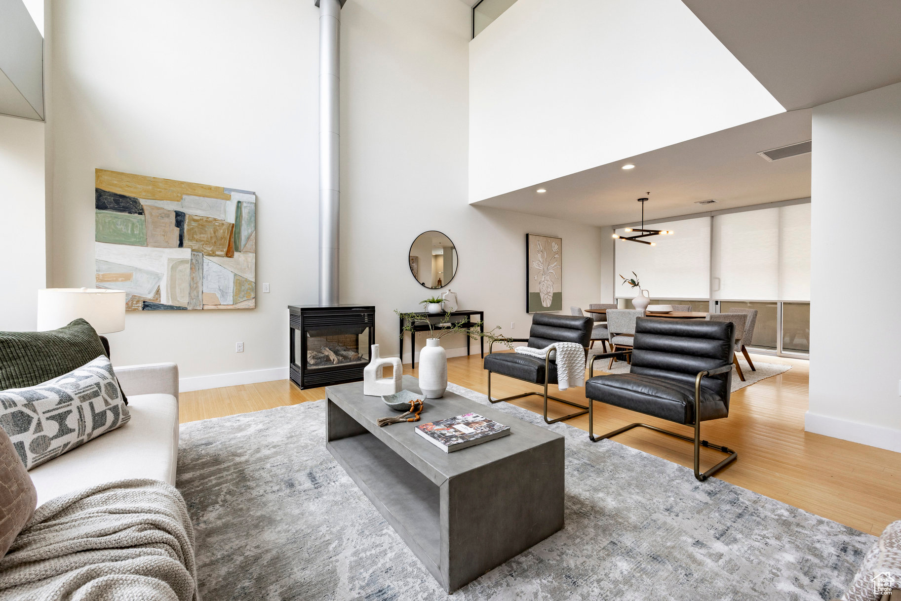 This stunning contemporary condominium offers a peaceful respite from the busy city streets below. Anchored on the historic Brooks Arcade building, which underwent a full restoration in 2002, this unit marries the charm of old with all the benefits of new construction. Floor to ceiling windows bring in lovely east-facing sunshine and add to the feeling of openness and calm that you will feel as you walk in the door. The private Primary en suite is spacious and soothing. Adding to the serenity, the entire rooftop is an urban oasis, an expansive park filled with mature trees and shrubs, elegant planters, inviting walkways, a separate firepit area and cozy meeting spaces. Your very own retreat from a hectic world.
