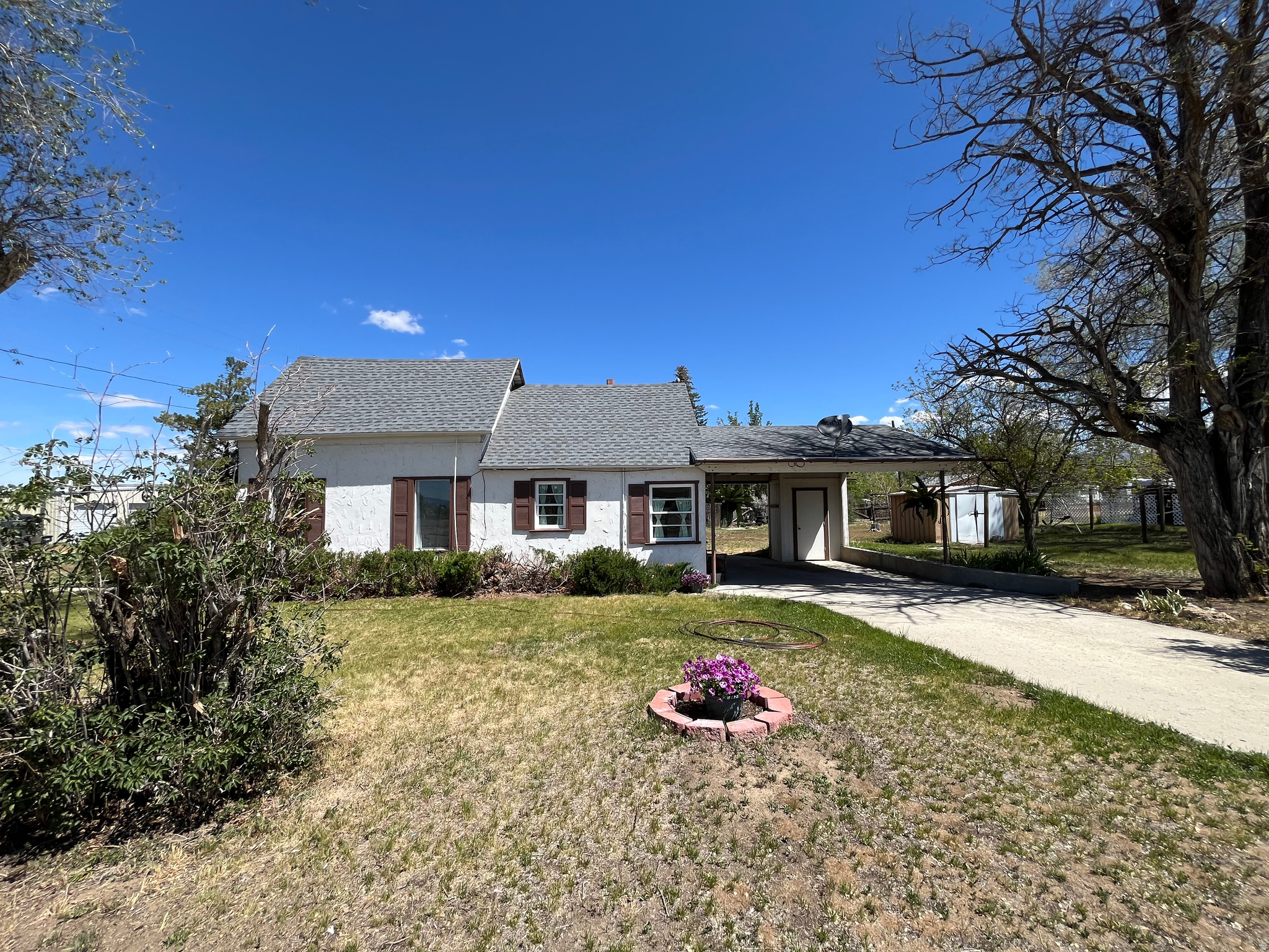 This home is in a great location with easy access to local schools, shopping, and everyday conveniences. The home features new flooring and fresh paint throughout, giving it a clean, updated feel. The bathroom has been recently updated, electrical has been upgraded, and all new plumbing through out the home offering added peace of mind. Brand new washer, dryer and refrigerator included. One share of irrigation water to be included with the sale. There's also potential room to grow, with space in the attic that could be finished and room on the property for a future addition if desired. With major improvements already done, this home is ready for its next owner to move in and make it their own. Square footage figures are provided as a courtesy estimate only and were obtained from county.Buyer is advised to obtain an independent measurement.