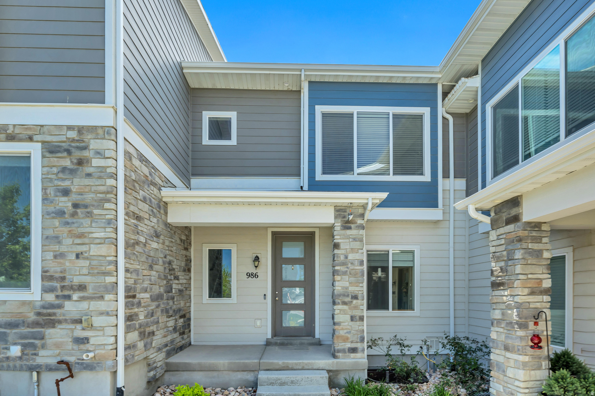 Searching for a property with versatility and income possibilities? This thoughtfully designed residence provides a setup that can accommodate extended family, guests, or rental use, offering the option to occupy part of the home while utilizing another section for supplemental income or private living quarters. The floor plan naturally supports privacy and separation, making it adaptable to a variety of lifestyles. Constructed in 2018 and exceptionally cared for, the home presents like new with a clean, modern feel and abundant sunlight throughout. Expansive windows brighten the interior and enhance the spacious main living areas, creating an airy and inviting environment. The open kitchen is beautifully finished with granite surfaces, stainless steel appliances, upgraded fixtures, and contemporary lighting that blend functionality with modern design. The home features three generously sized bedrooms and two full baths, offering comfortable accommodations with room to spread out. High-speed fiber internet is covered through the affordable HOA dues. Situated in a peaceful and well-maintained community, the location offers excellent accessibility to major commuting routes including I-15, Redwood Road, and Bangerter Highway. Parks, recreation areas, swimming pools, schools, and playgrounds are all nearby, many within easy walking distance. All square footage information is provided as a courtesy estimate based on county tax data. Buyers are encouraged to verify all measurements independently. TV mount included.