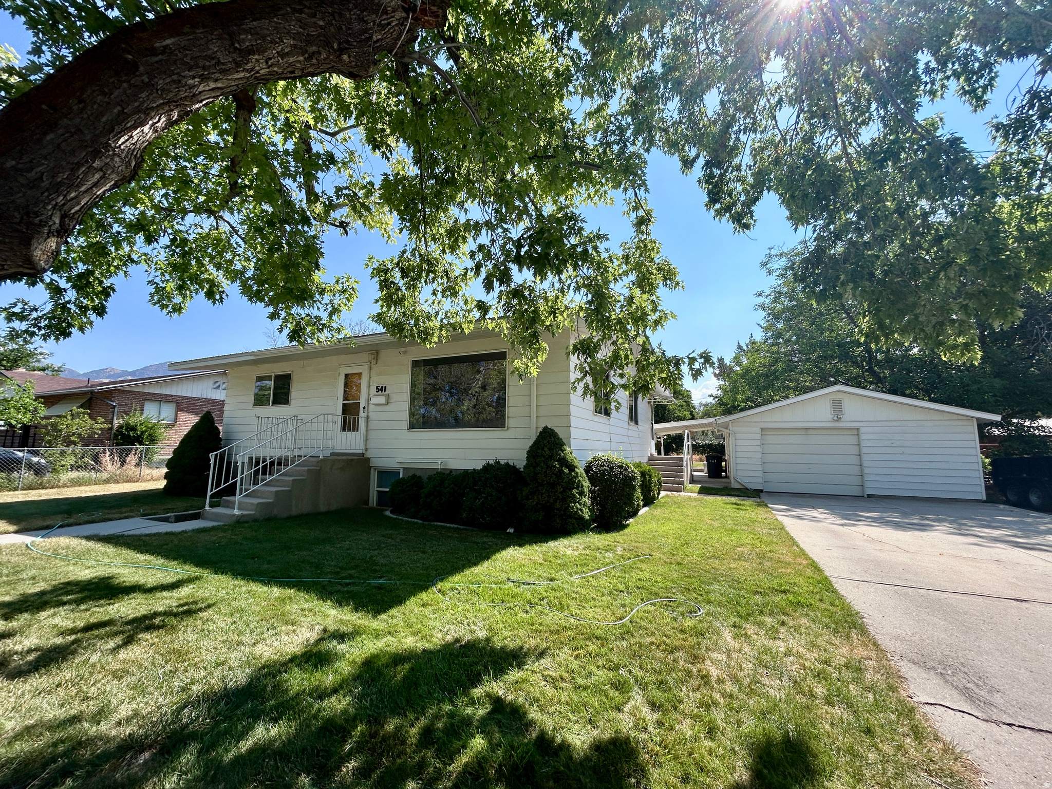 No Showings until Monday, July 27th. Inside pictures will also be posted on Monday. Lots of opportunity to supplement your mortgage payment when you live in one half and rent out the other half. The home features a separate "mother-in-law" apartment in the basement with its own entrance and has a laundry area that is accessible to both the main floor and basement. The huge .33 acre lots features a covered patio, sprinklers for the lawn area and irrigation for the large garden area. The oversized detached garage features a workshop with many storage lockers for your tools. There are also two furnaces, central A/C for the main floor, mostly newer windows, and two water heaters. The listing agents represent the seller only, so please call your favorite buyer agent to see this home.